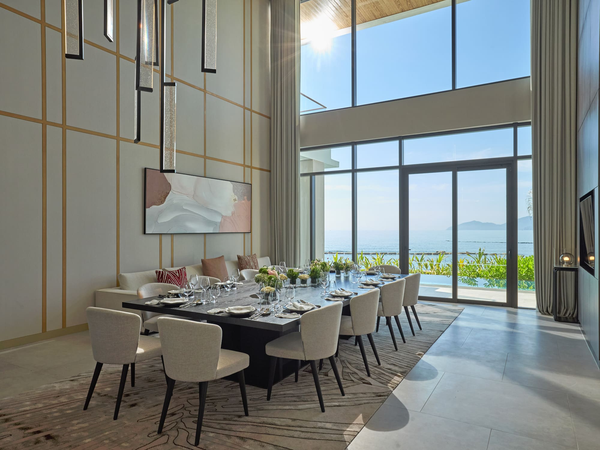 a dining room with a large table and chairs