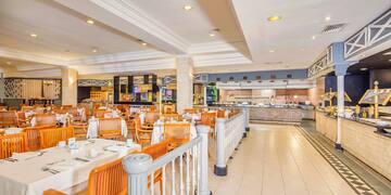 a restaurant with tables and chairs