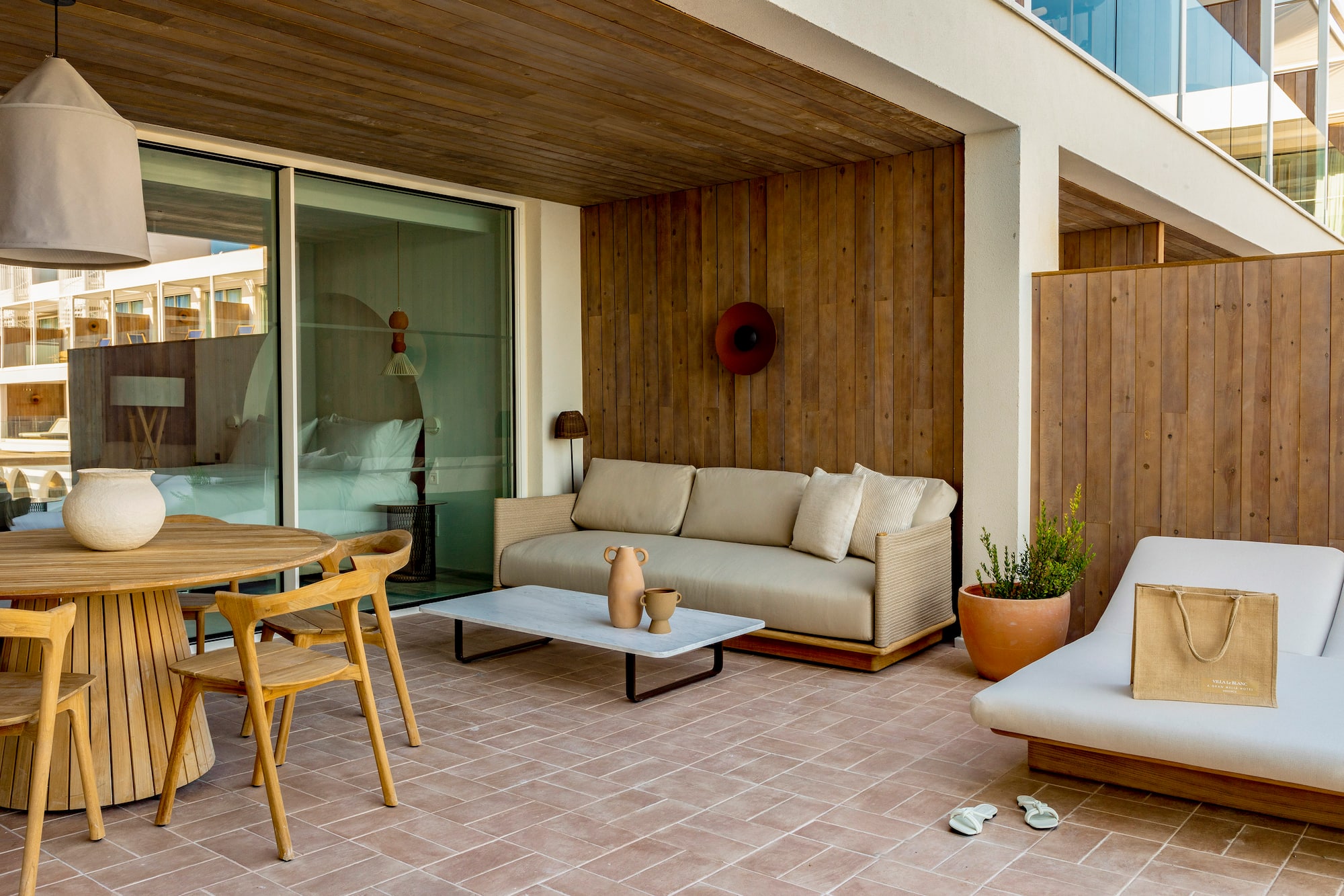 a patio with furniture and a table