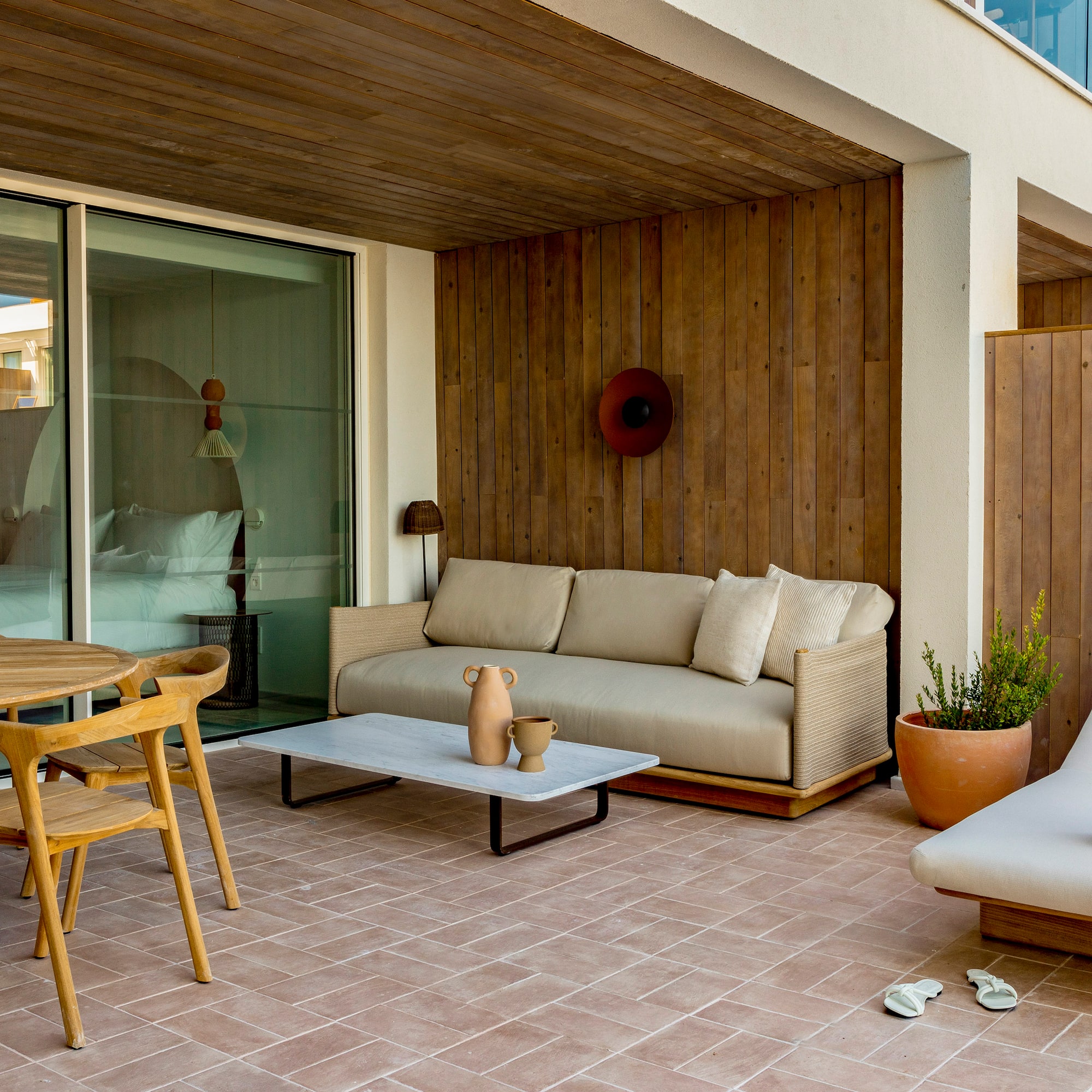 a patio with furniture and a table
