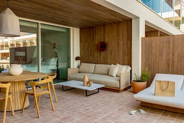 a patio with furniture and a table