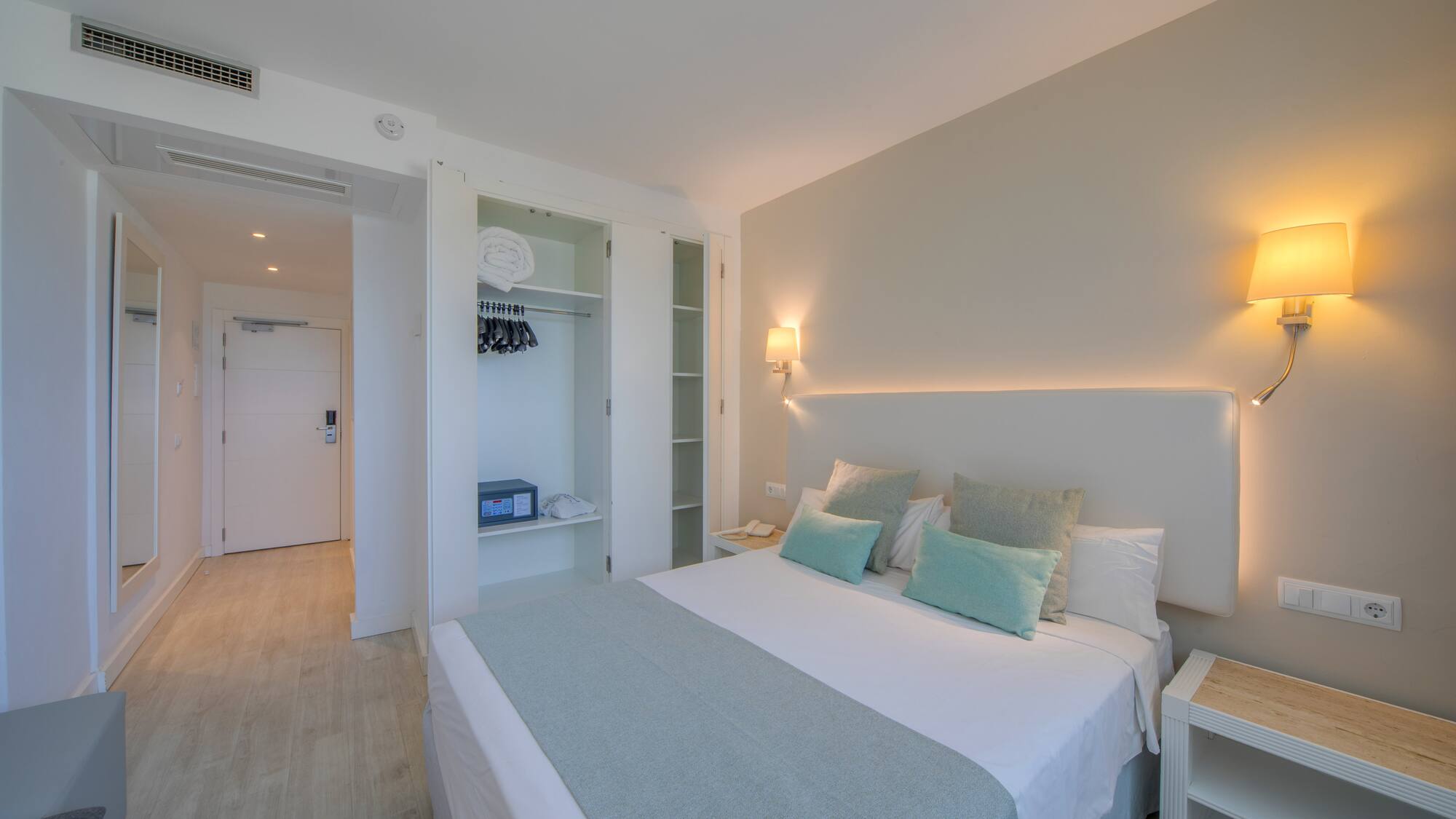 a bedroom with a bed and a closet