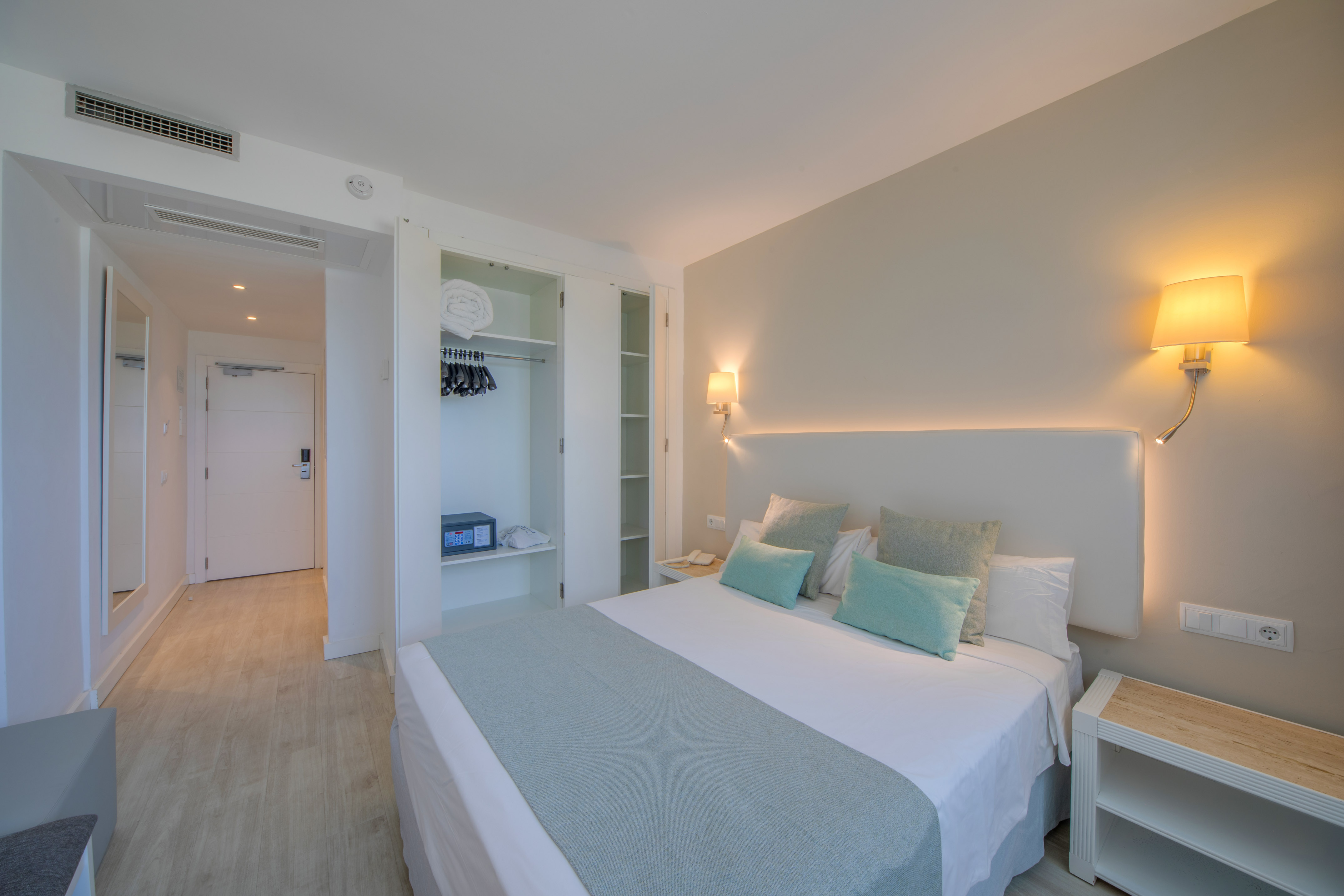 a bedroom with a bed and a closet