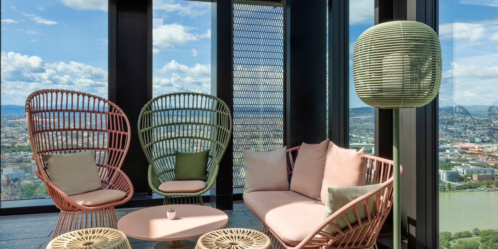 a room with wicker furniture and a table