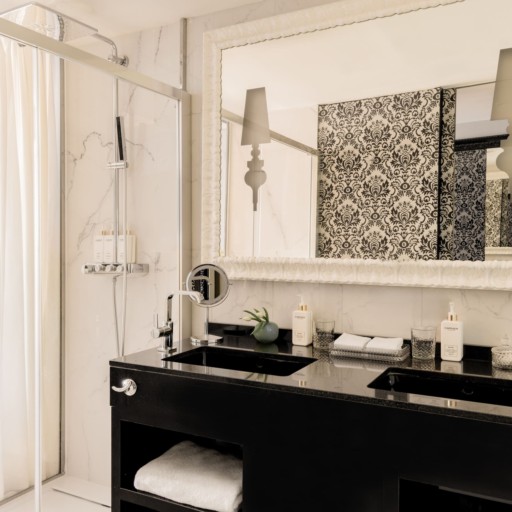 a bathroom with a mirror and a black counter