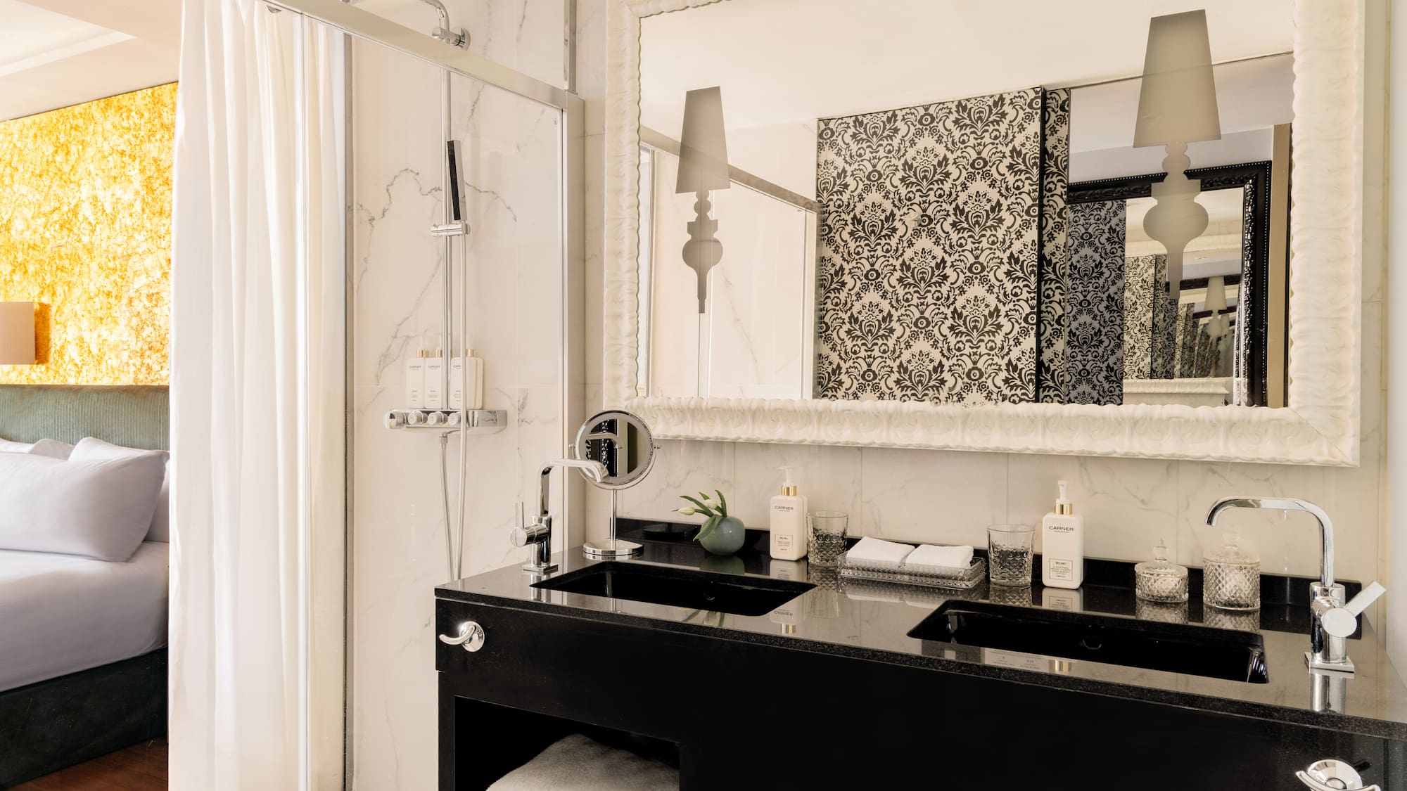a bathroom with a mirror and a black counter