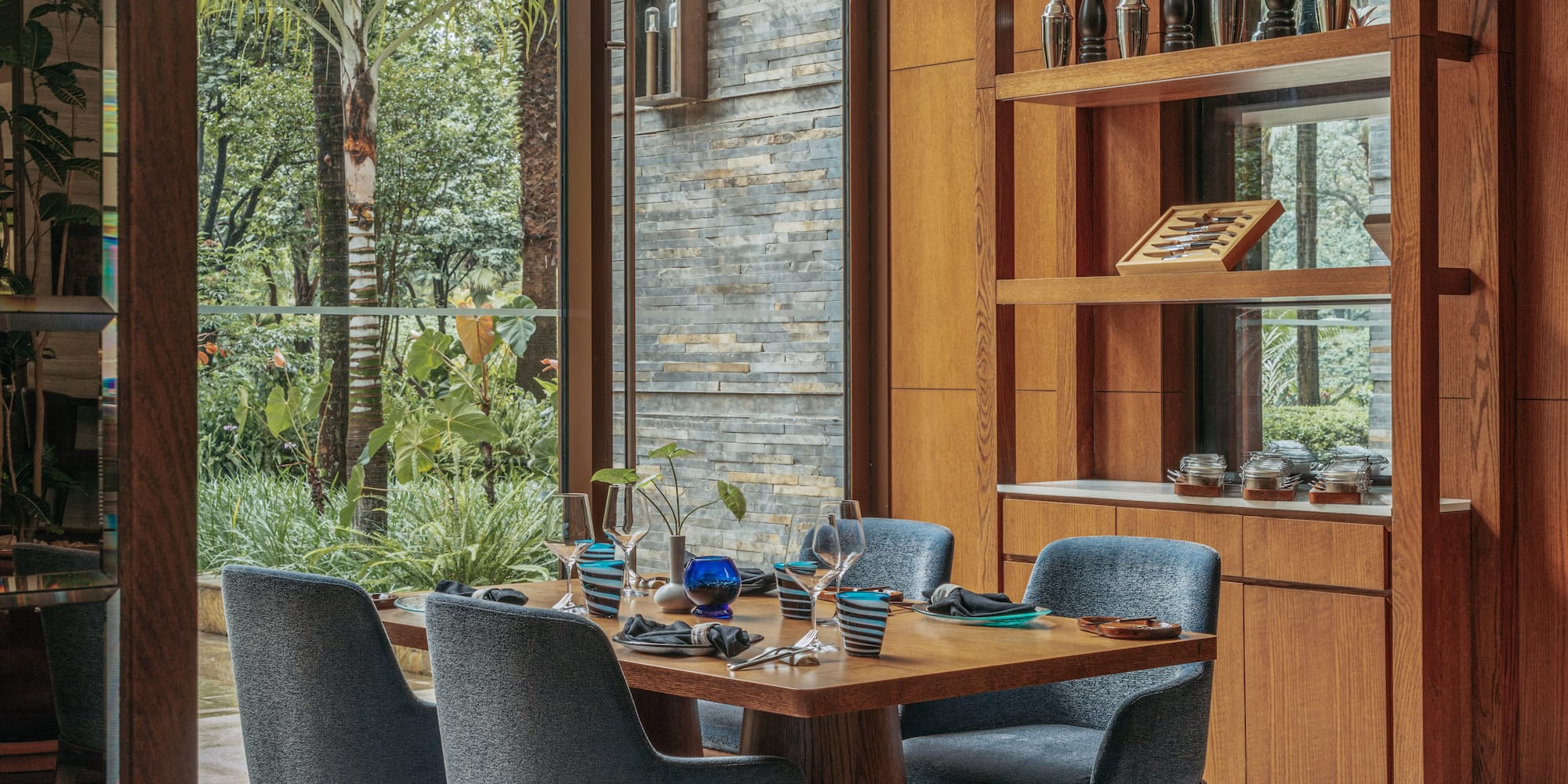 a dining room with a table and chairs