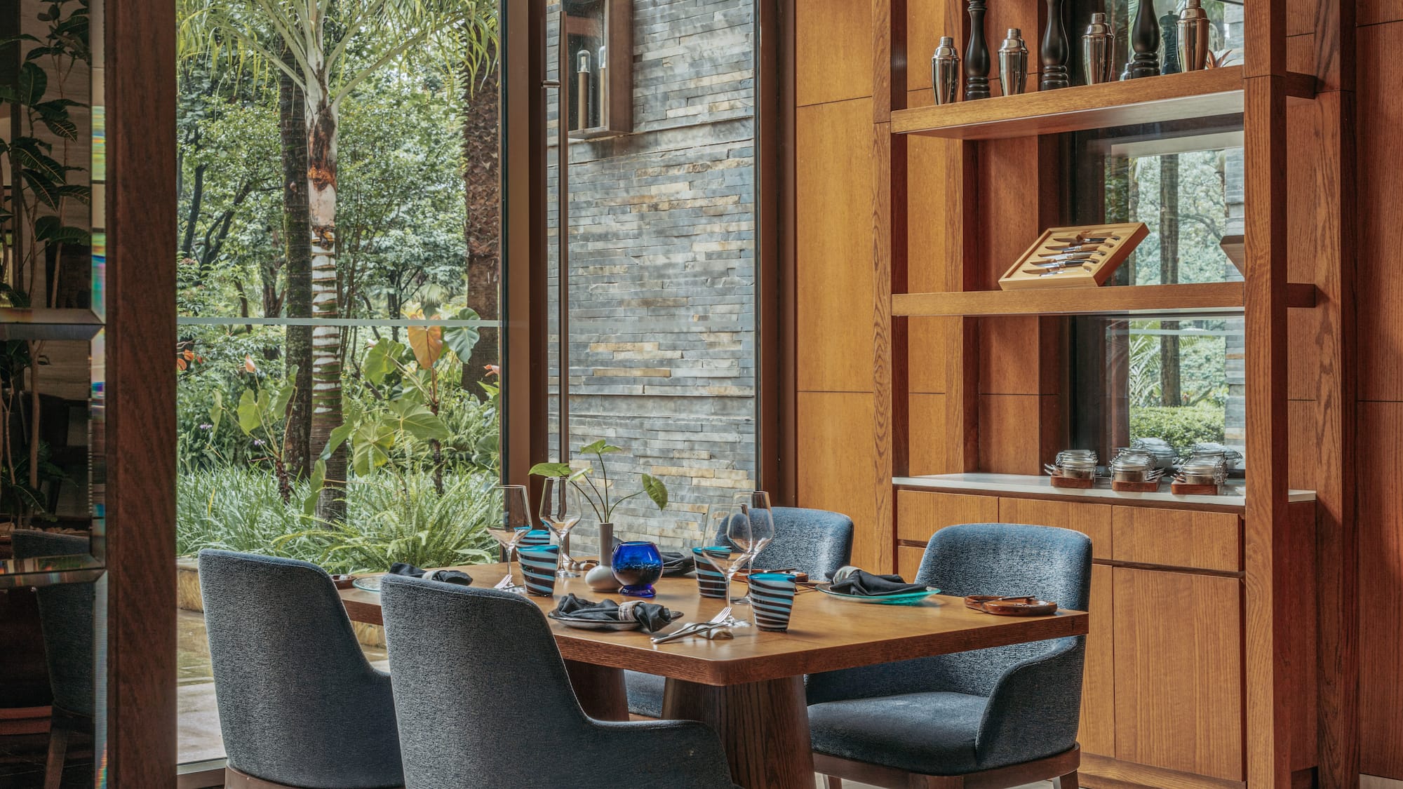 a dining room with a table and chairs