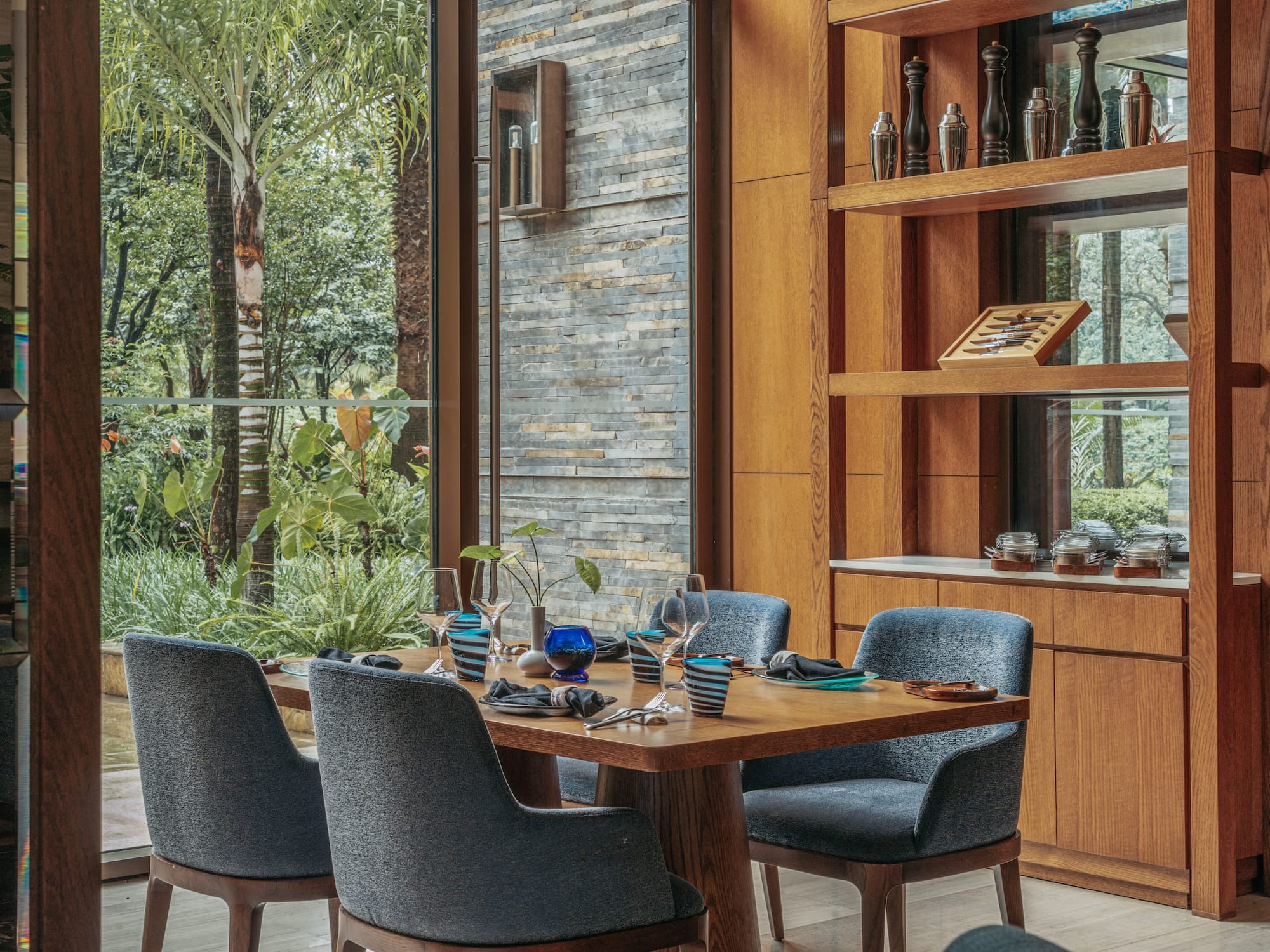 a dining room with a table and chairs