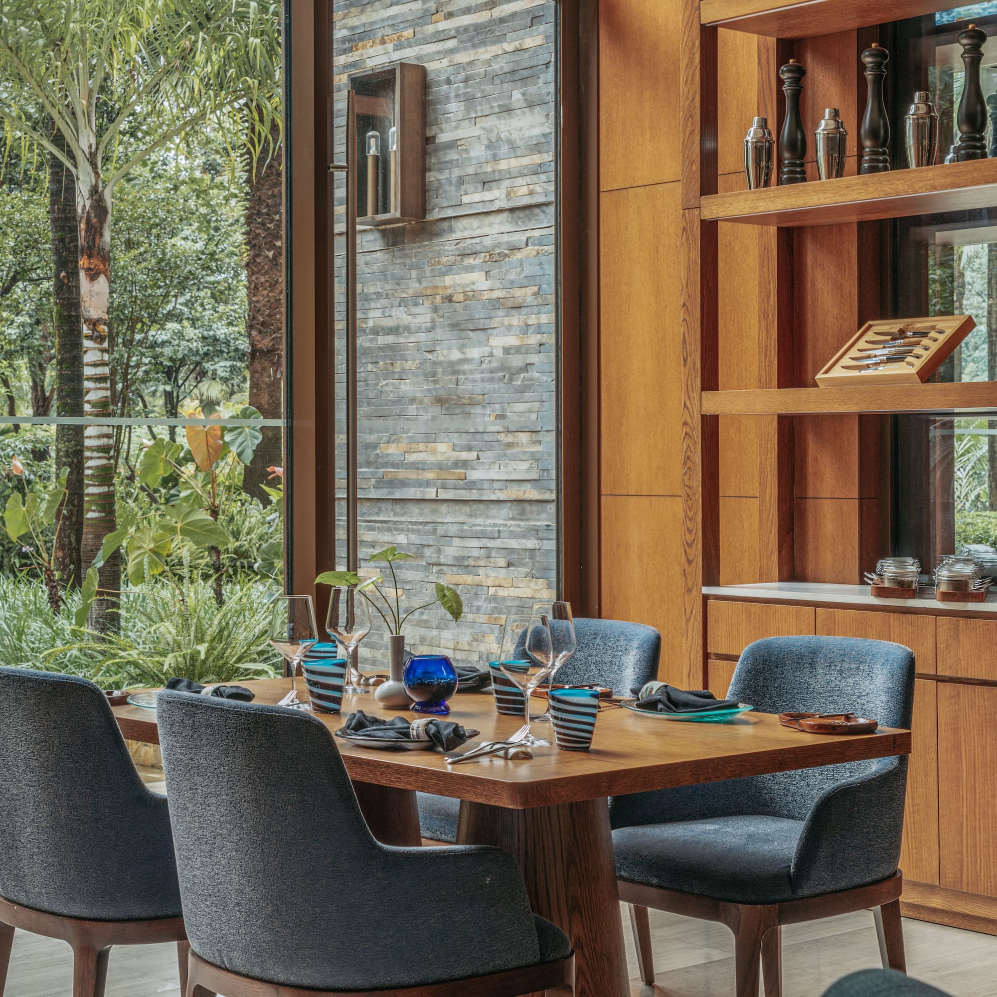 a dining room with a table and chairs