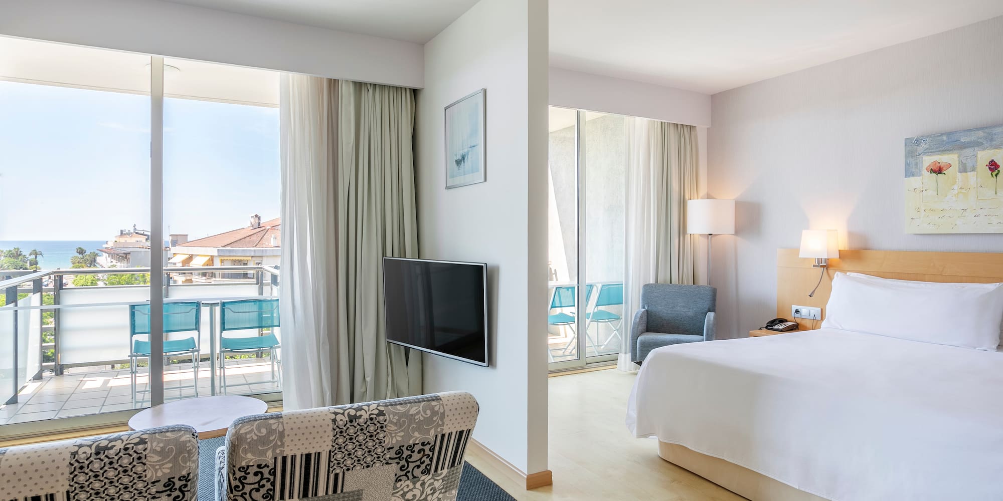 a bedroom with a television and a bed