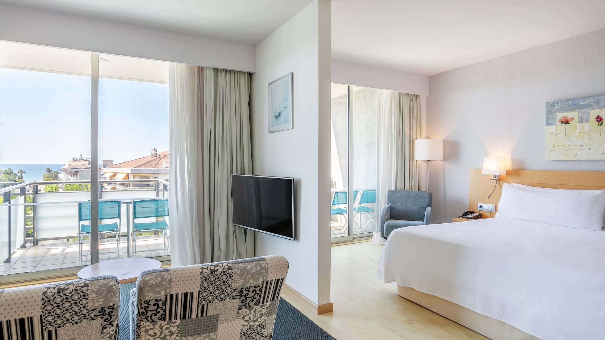 a bedroom with a television and a bed