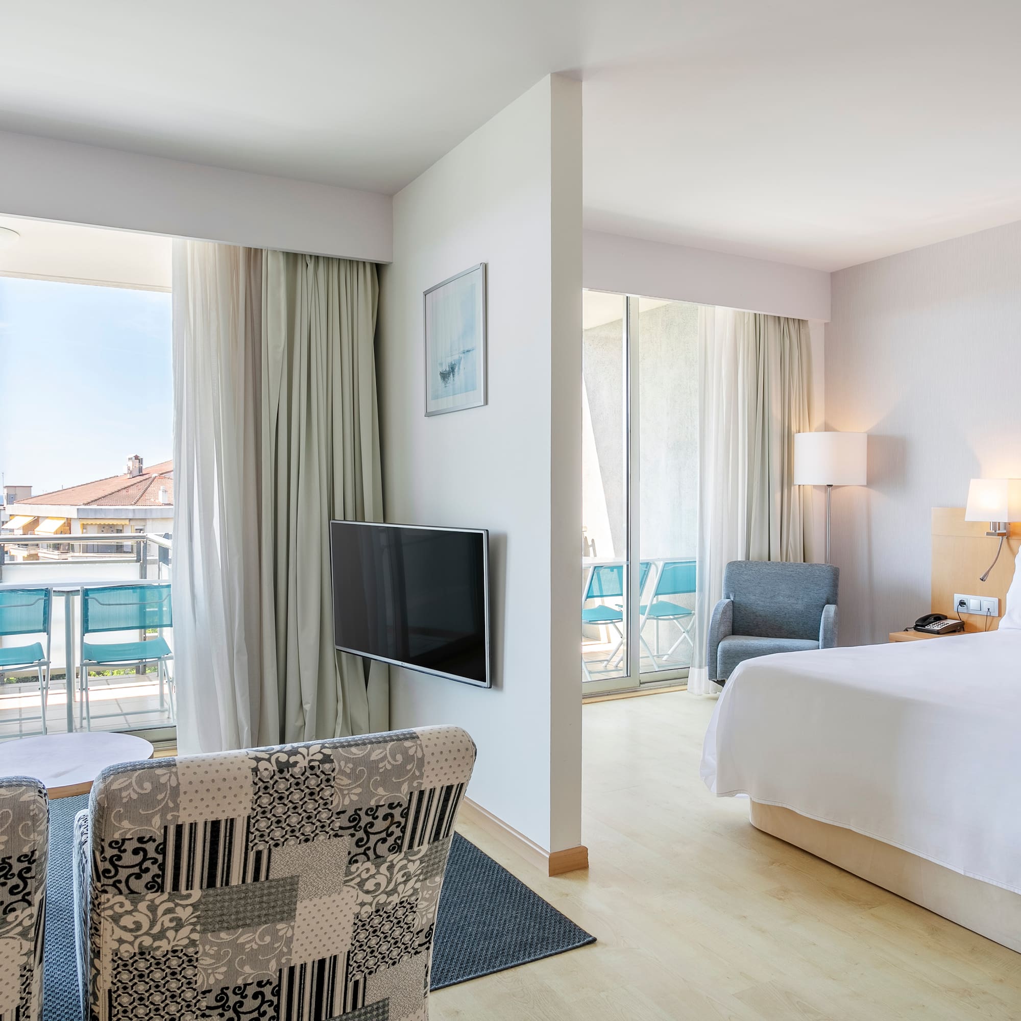 a bedroom with a television and a bed