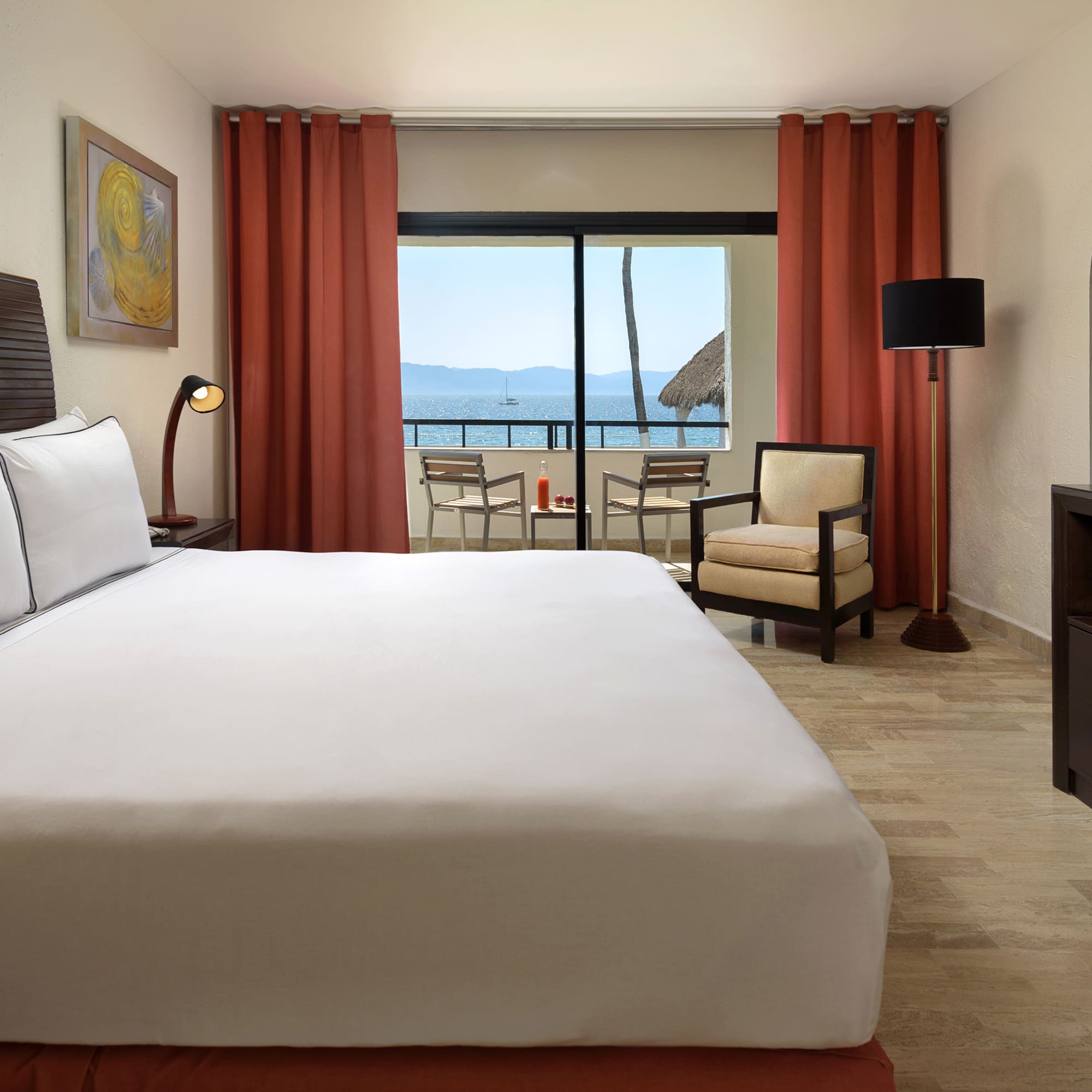 a room with a bed and a television