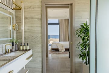 a bathroom with a sink and a plant