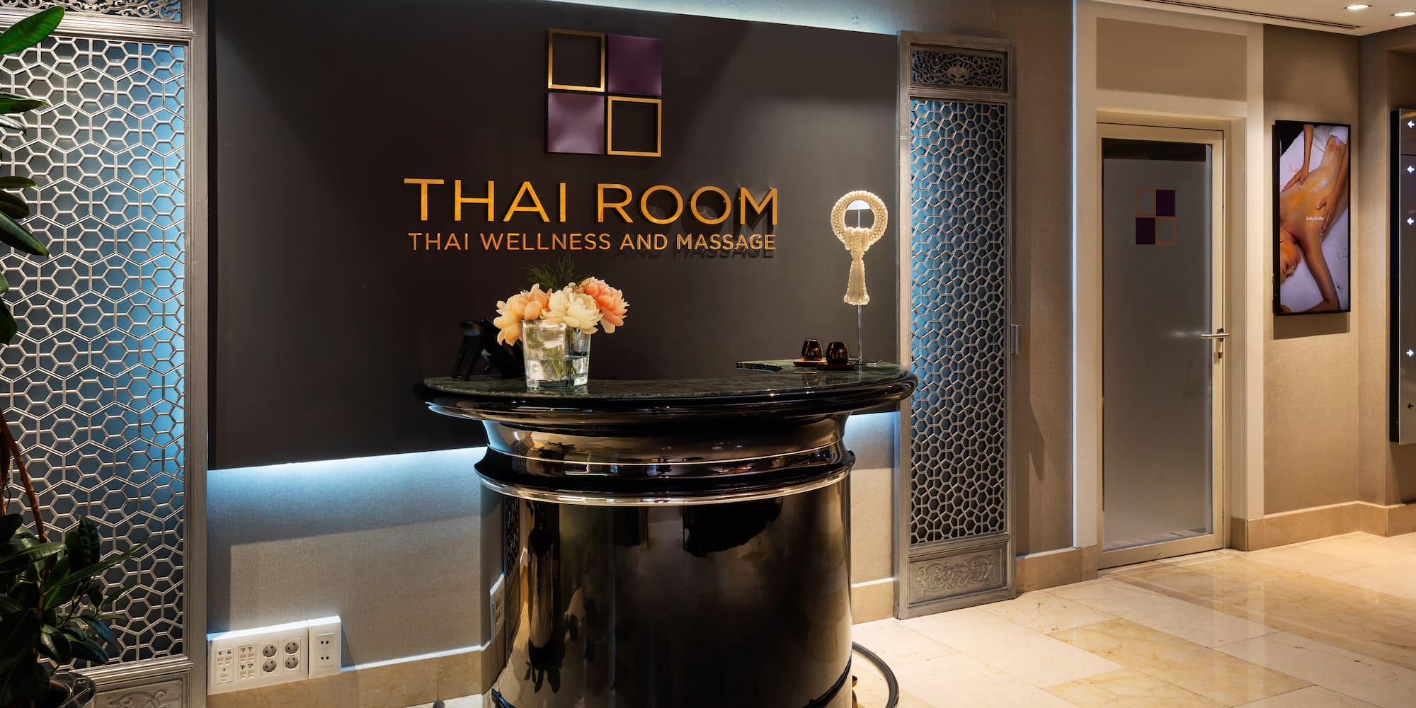 a black reception desk in a hotel