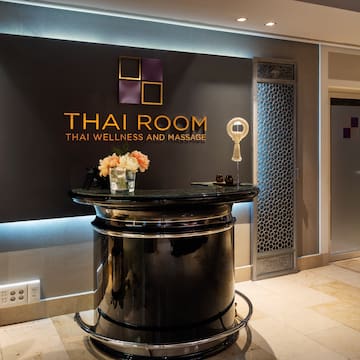 a black reception desk in a hotel