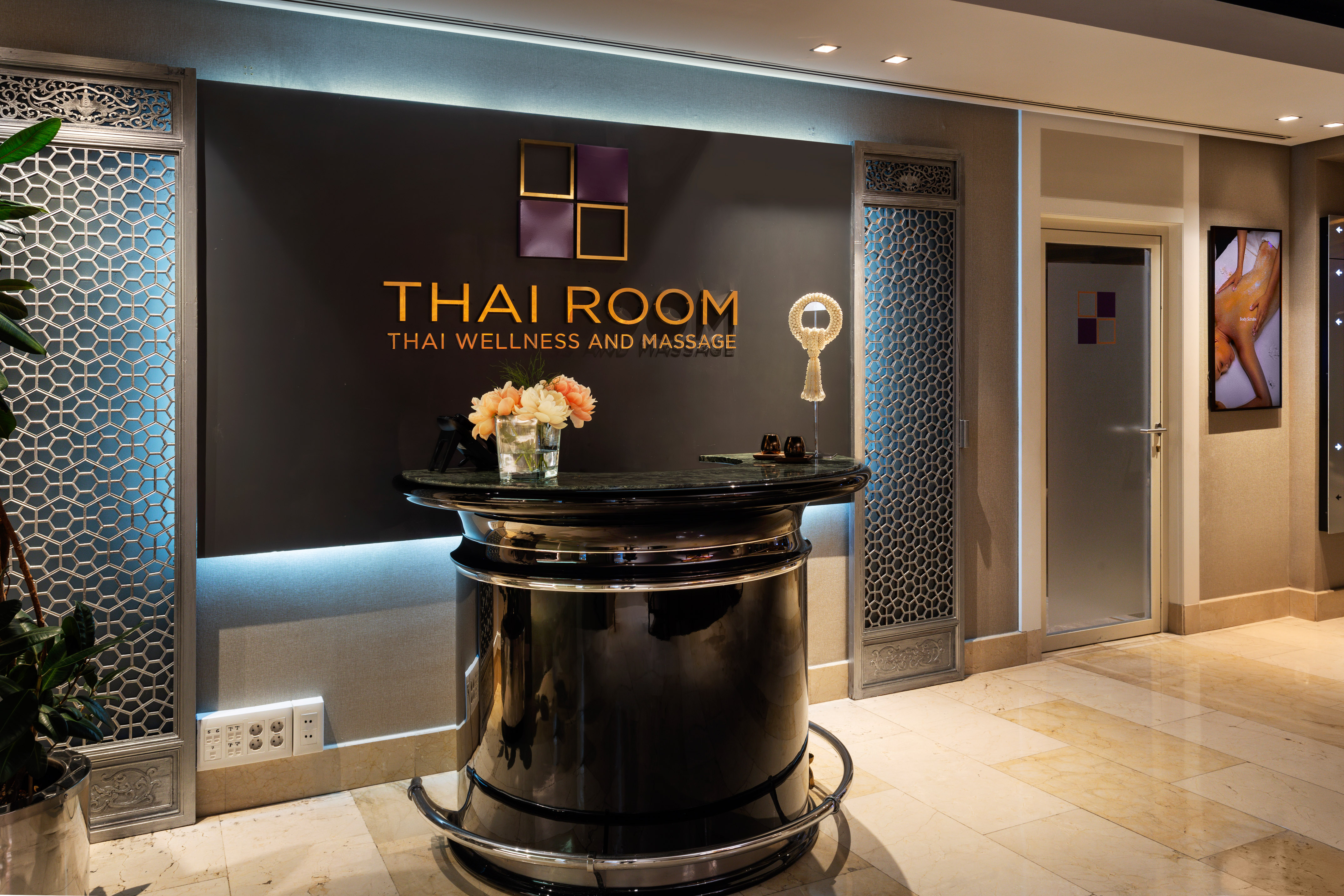 a black reception desk in a hotel