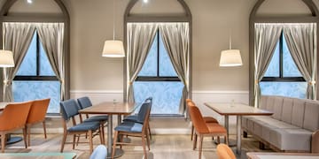 a room with tables and chairs