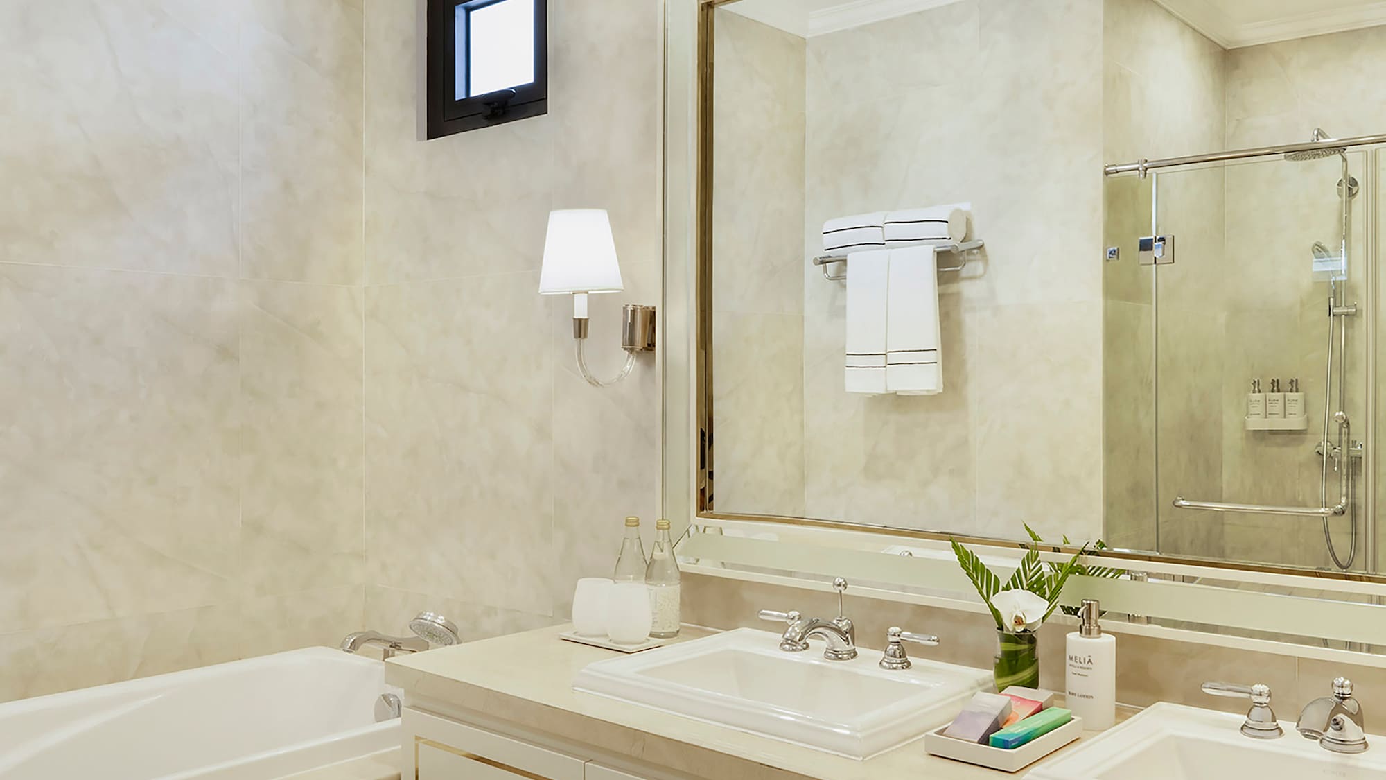 a bathroom with a large mirror and sink