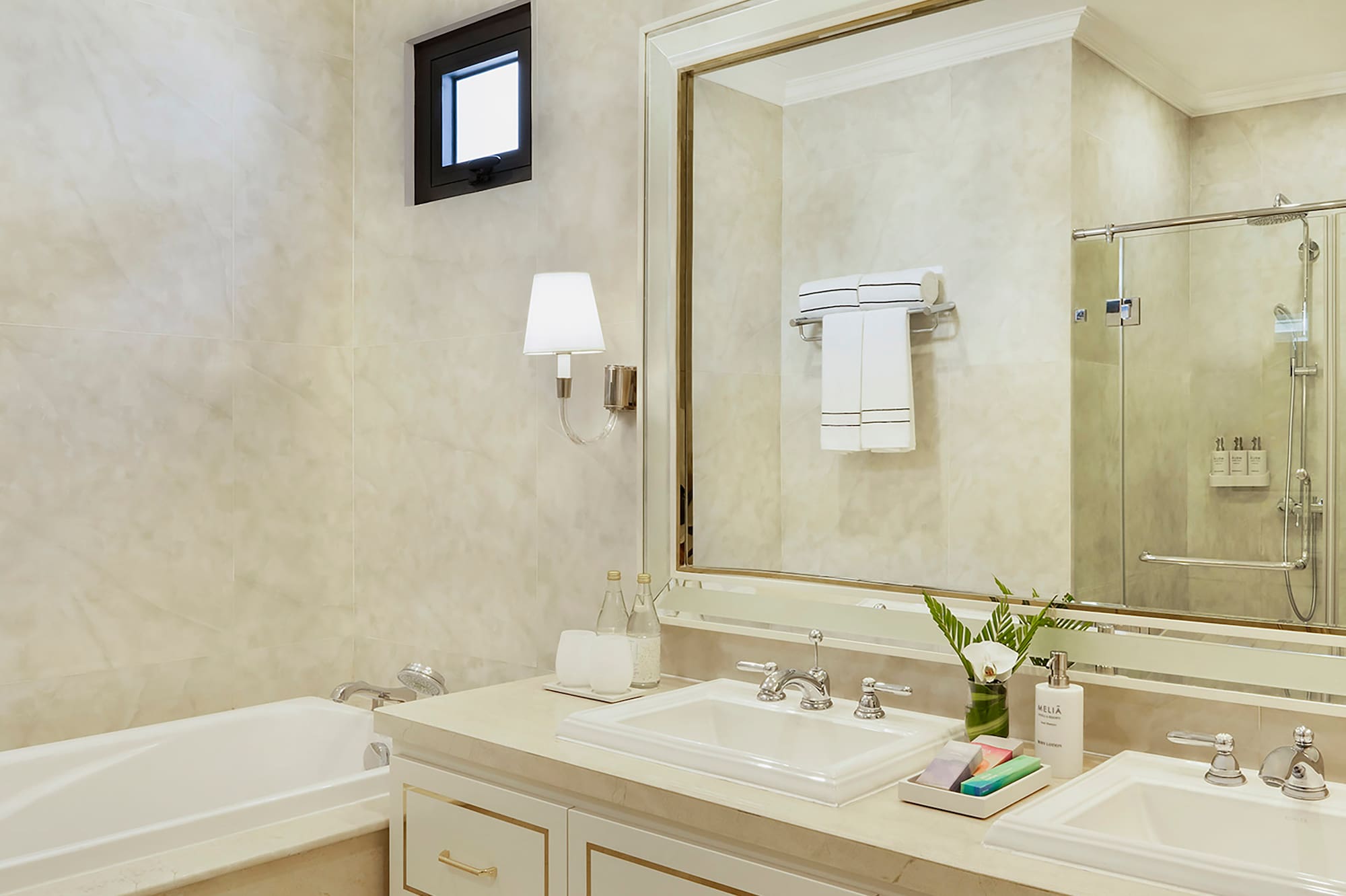 a bathroom with a large mirror and sink