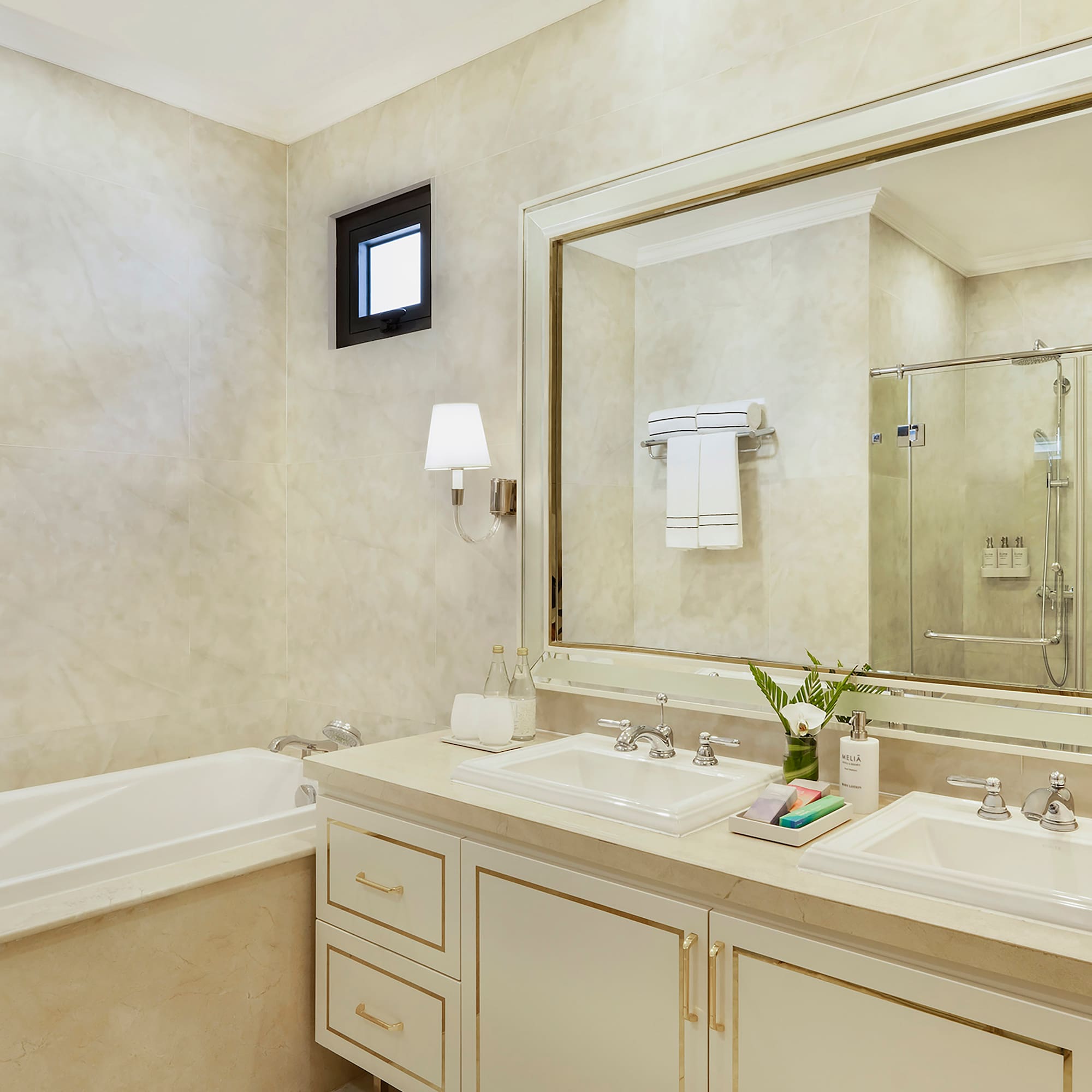 a bathroom with a large mirror and sink