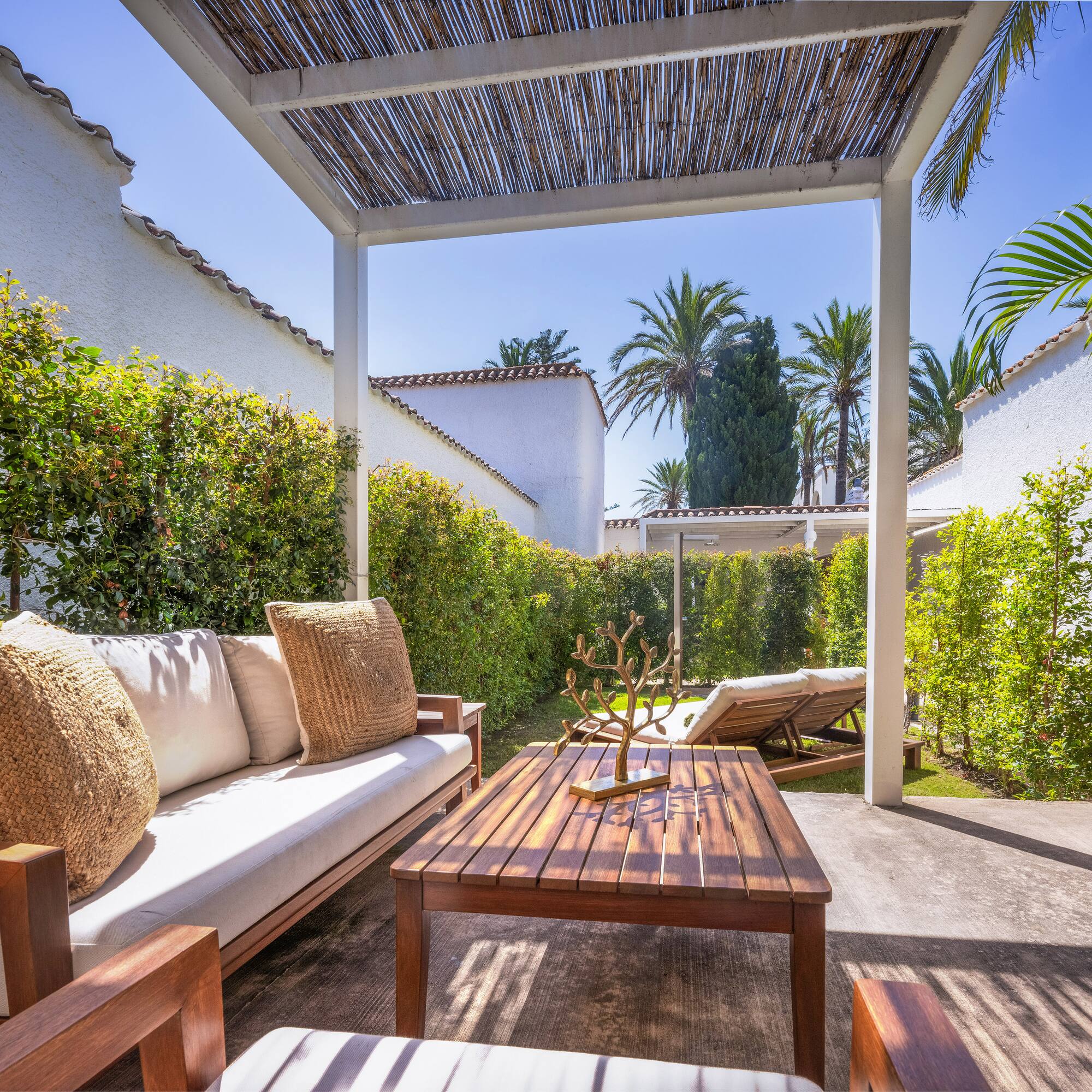 a patio with a table and chairs