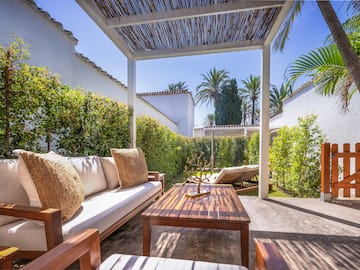 a patio with a table and chairs