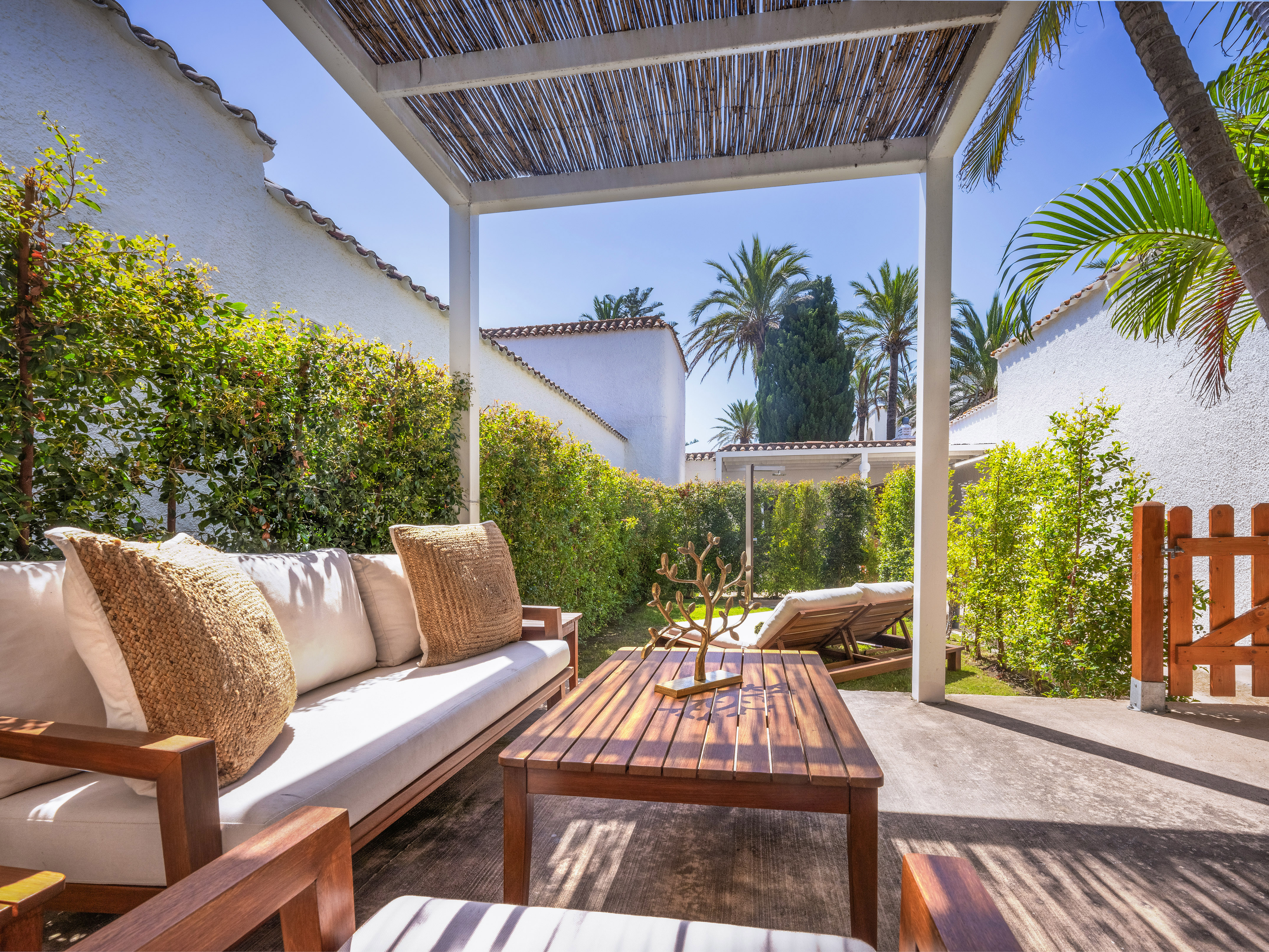 a patio with a table and chairs