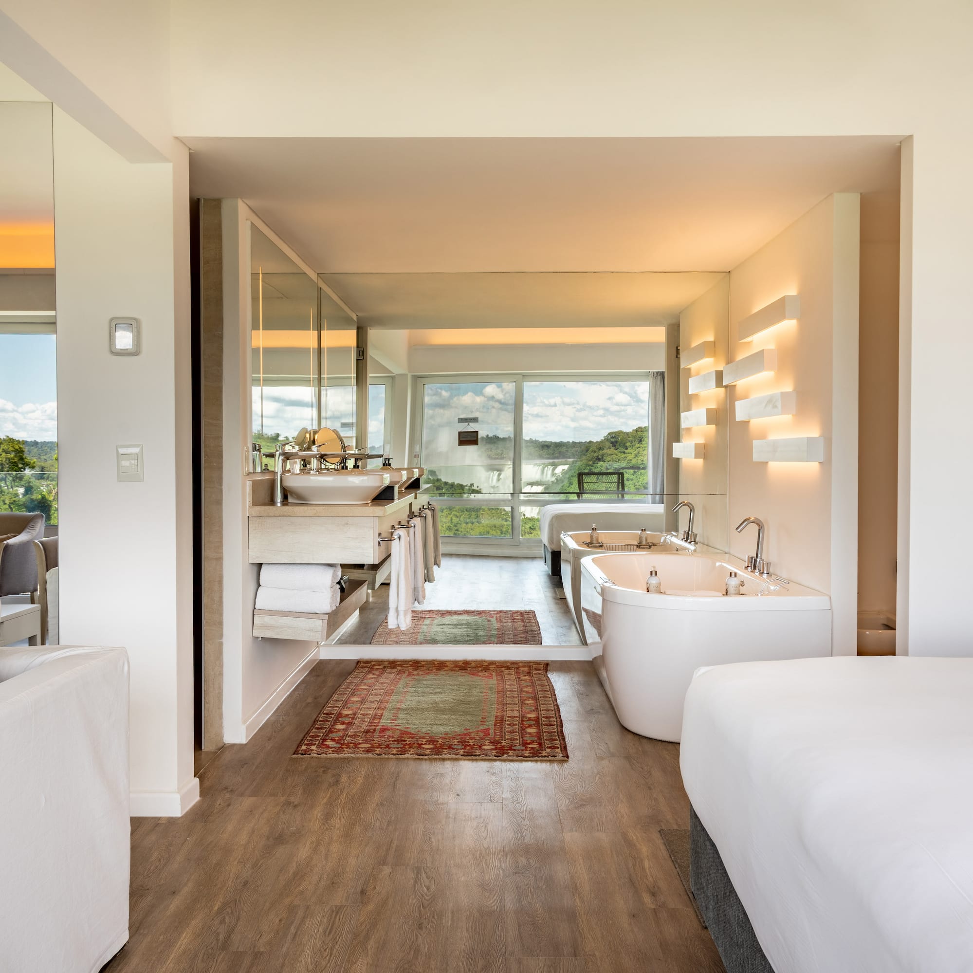 a room with a bed and a bathtub