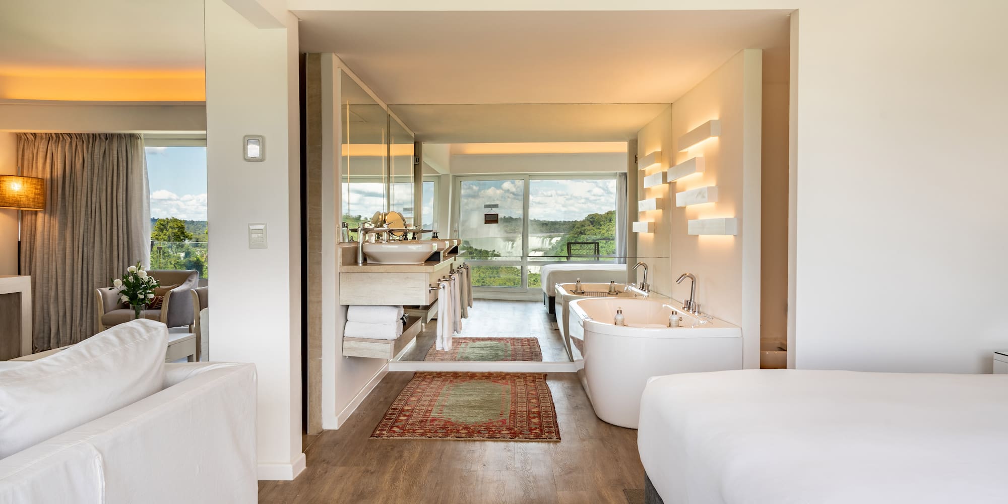 a room with a bed and a bathtub