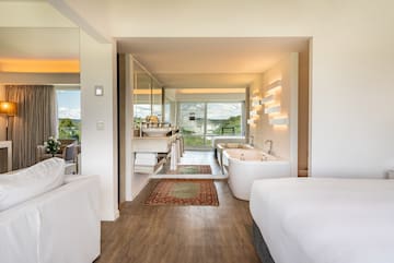 a room with a bed and a bathtub