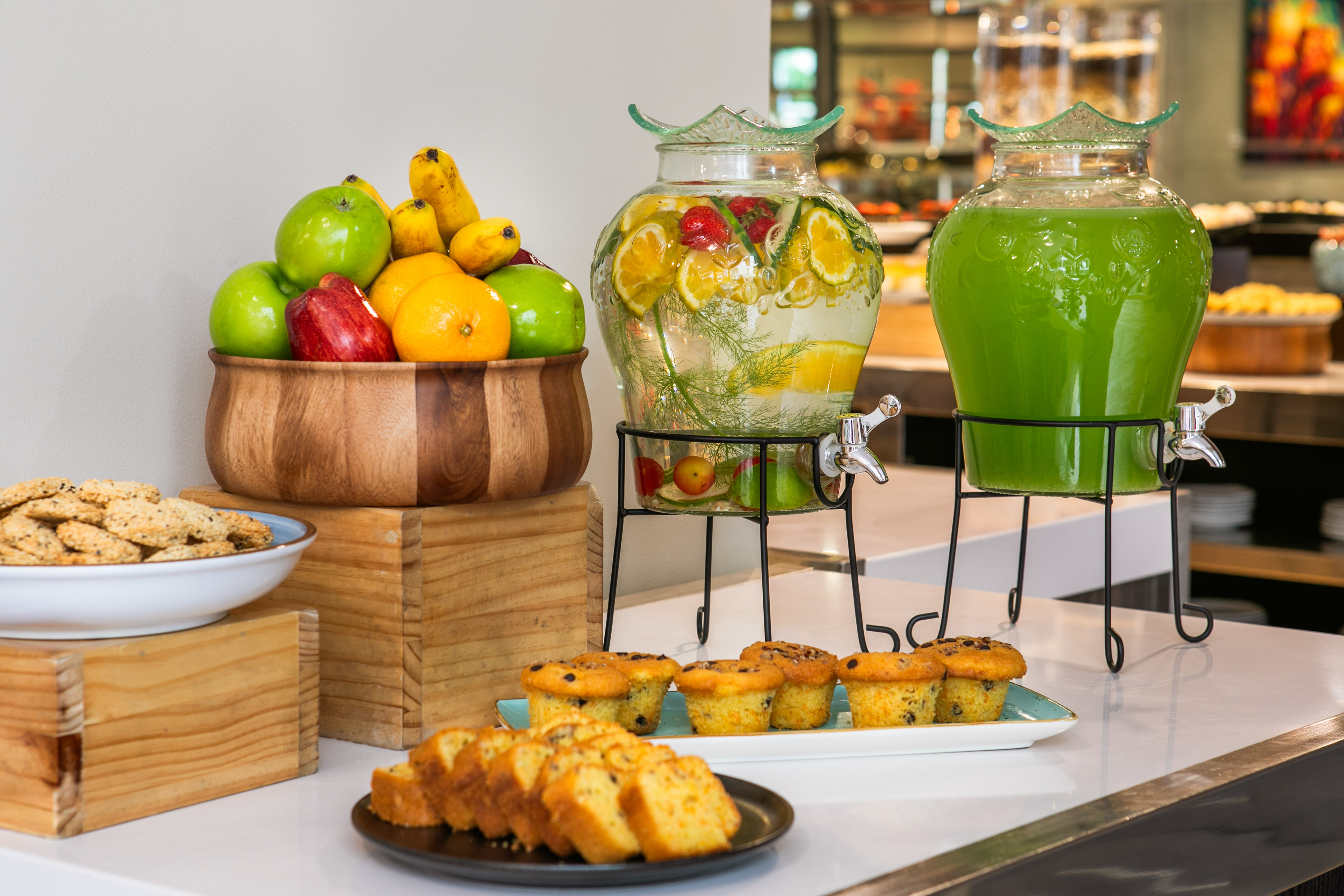 Hotel breakfast buffet with fresh fruit, infused water, green juice, and pastries. - Hotel Cusco La Paccha Affiliated by Meliá, Cusco