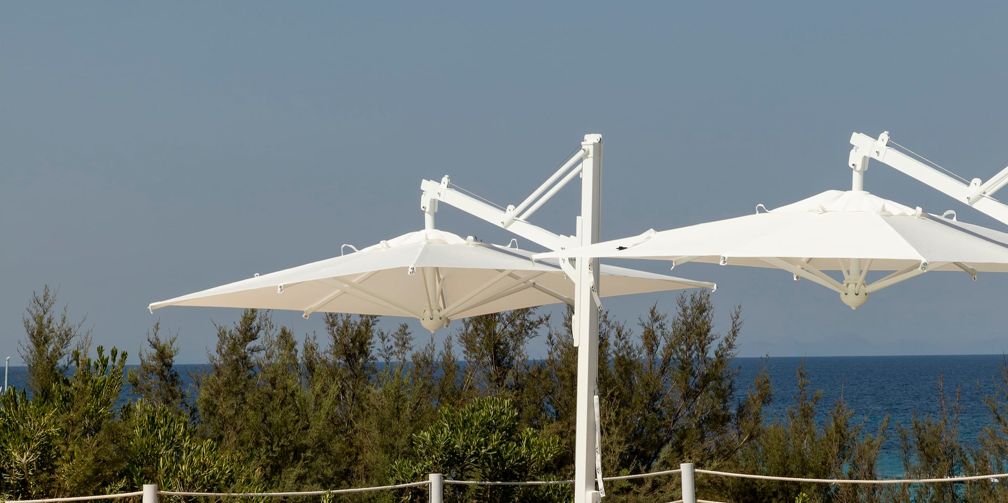 a pool with lounge chairs and umbrellas