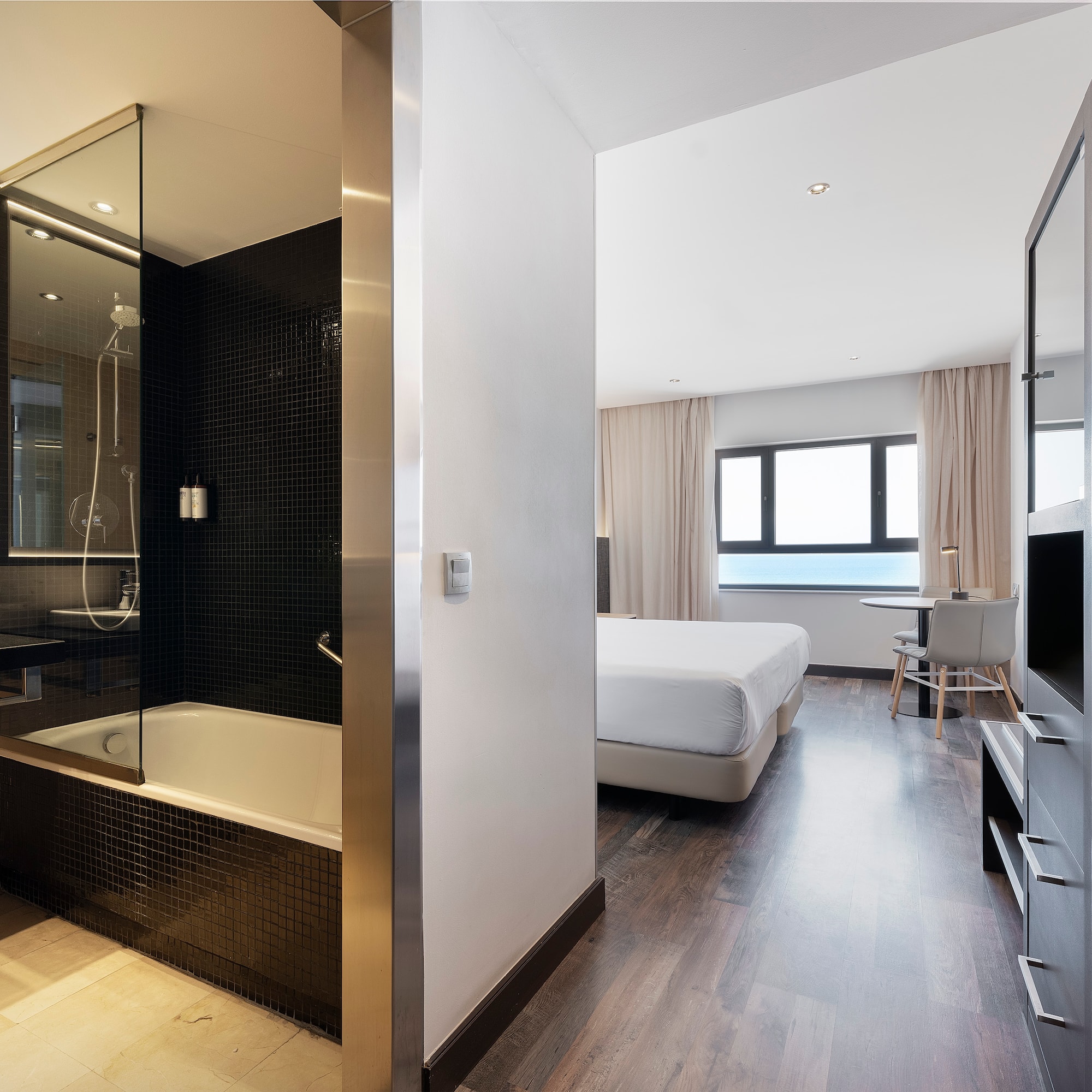 a room with a bed and a shower