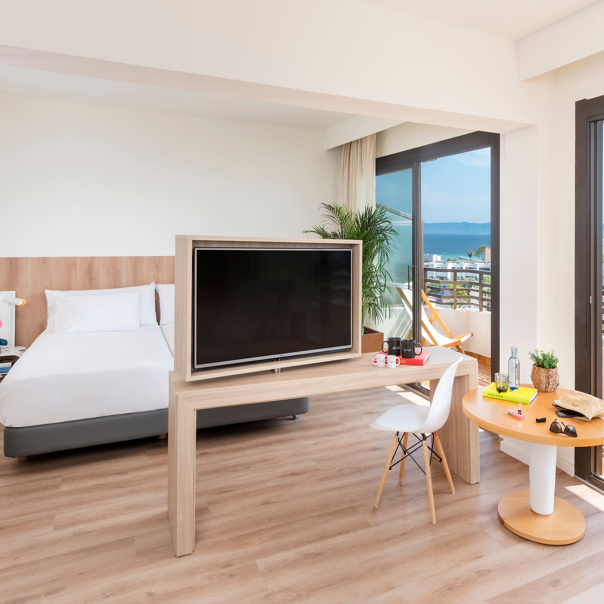 a room with a television and a bed