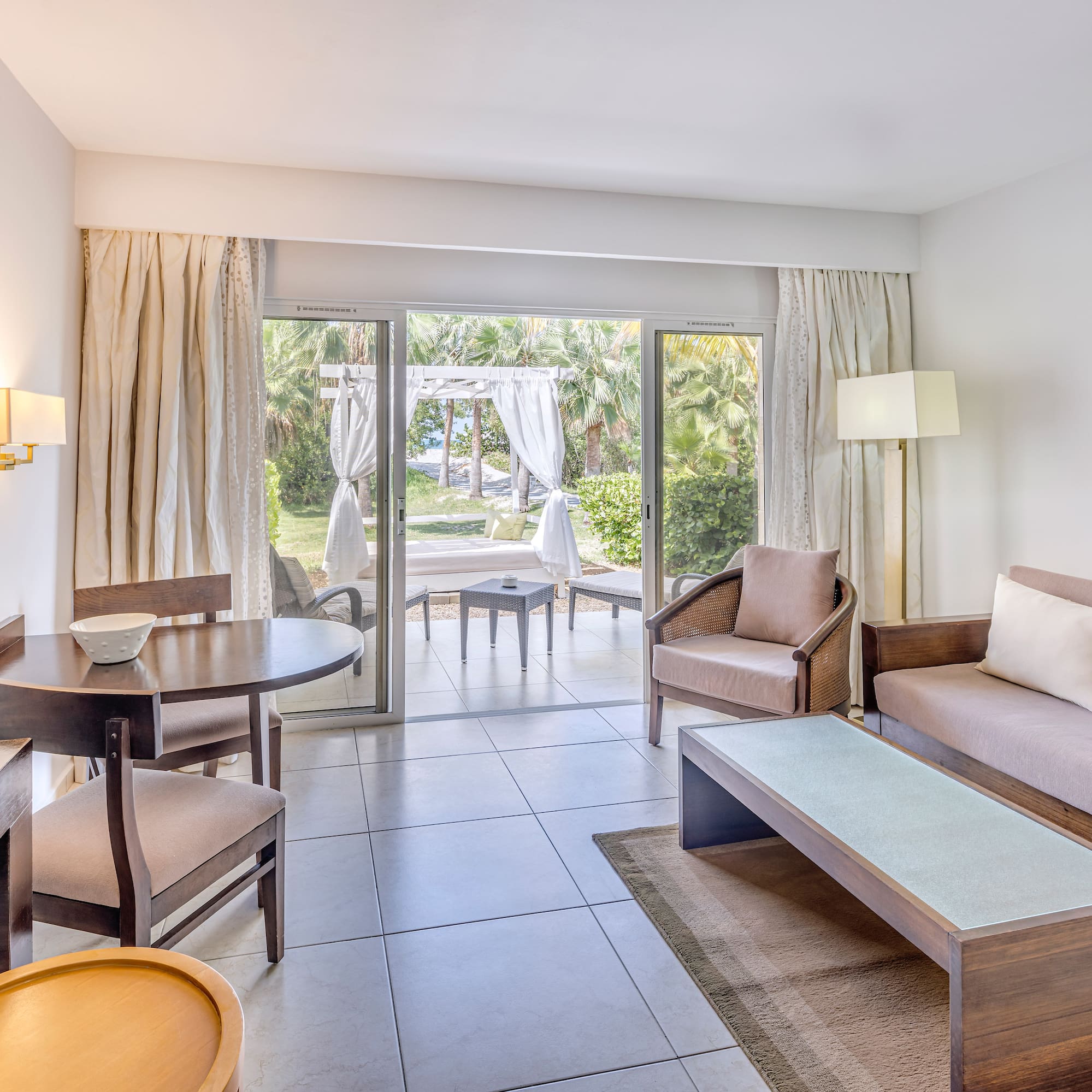 a living room with a table and chairs