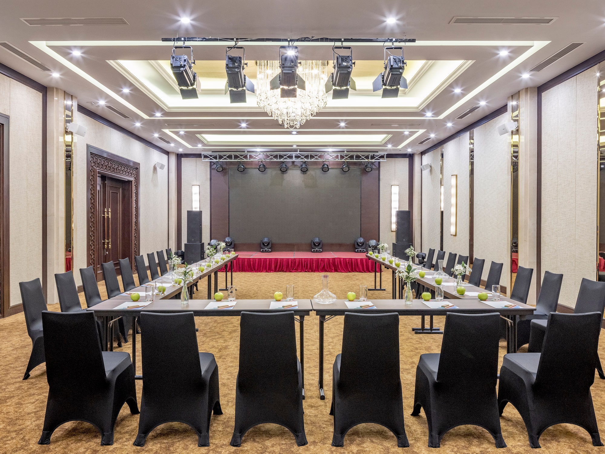 a room with a large table and chairs