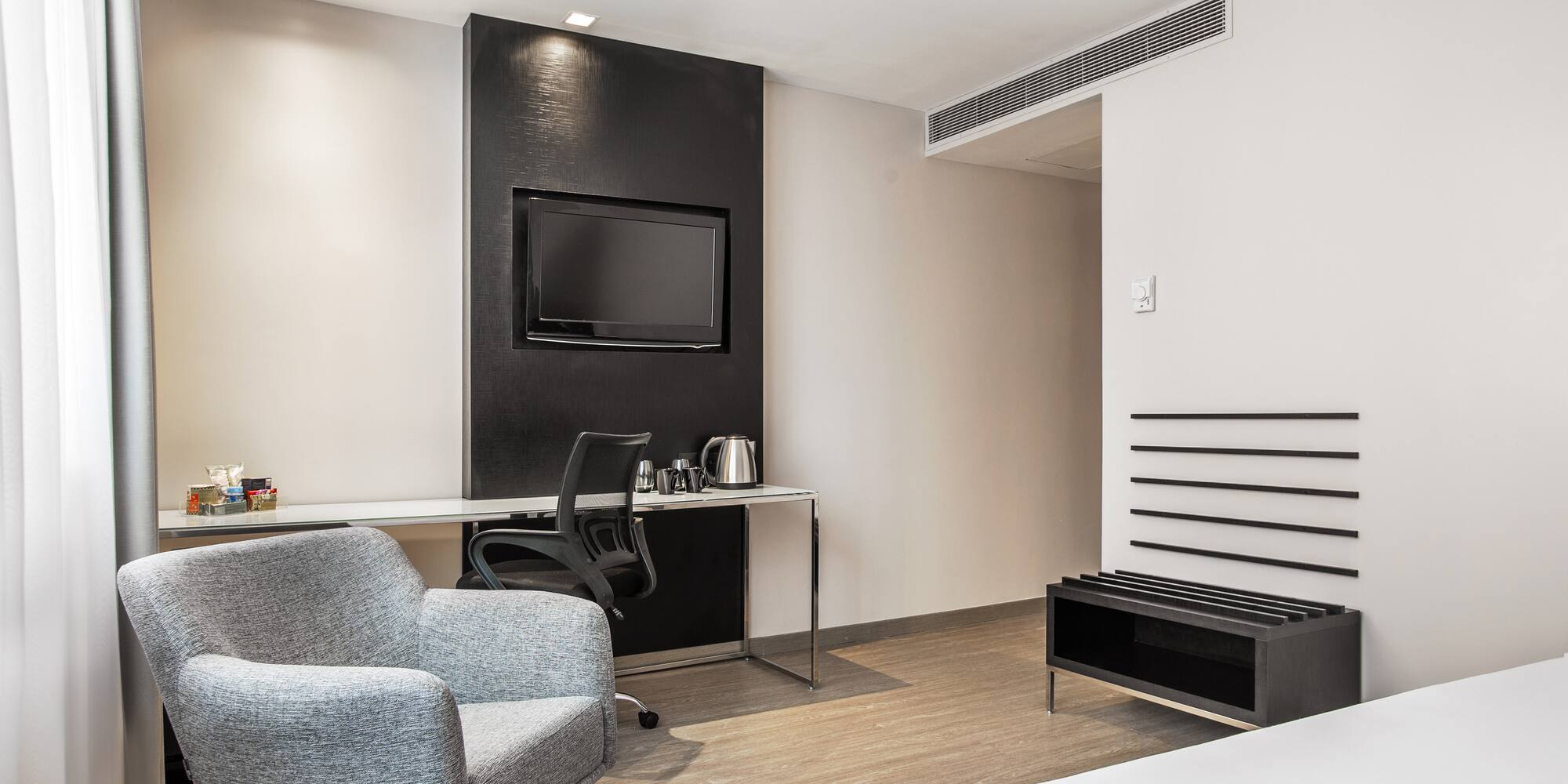 a room with a bed and a chair