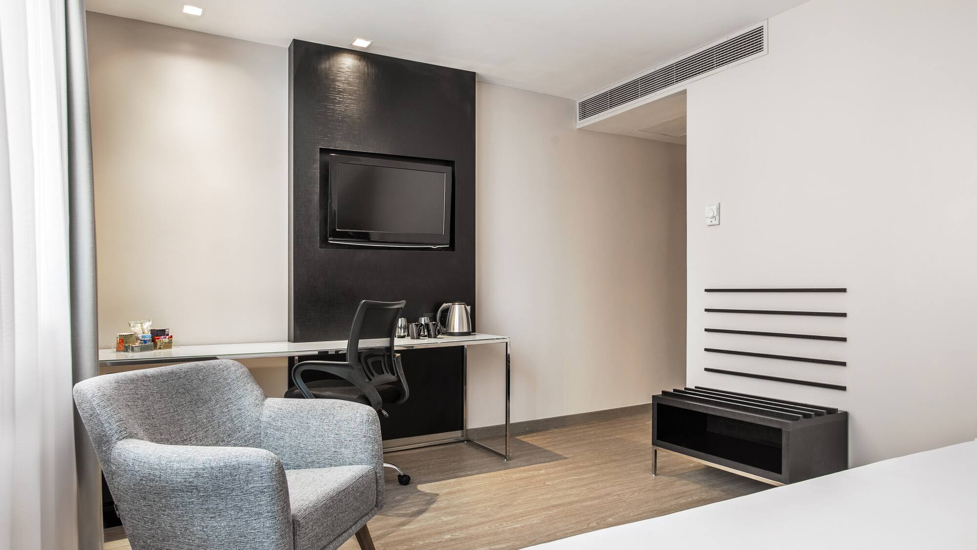 a room with a bed and a chair