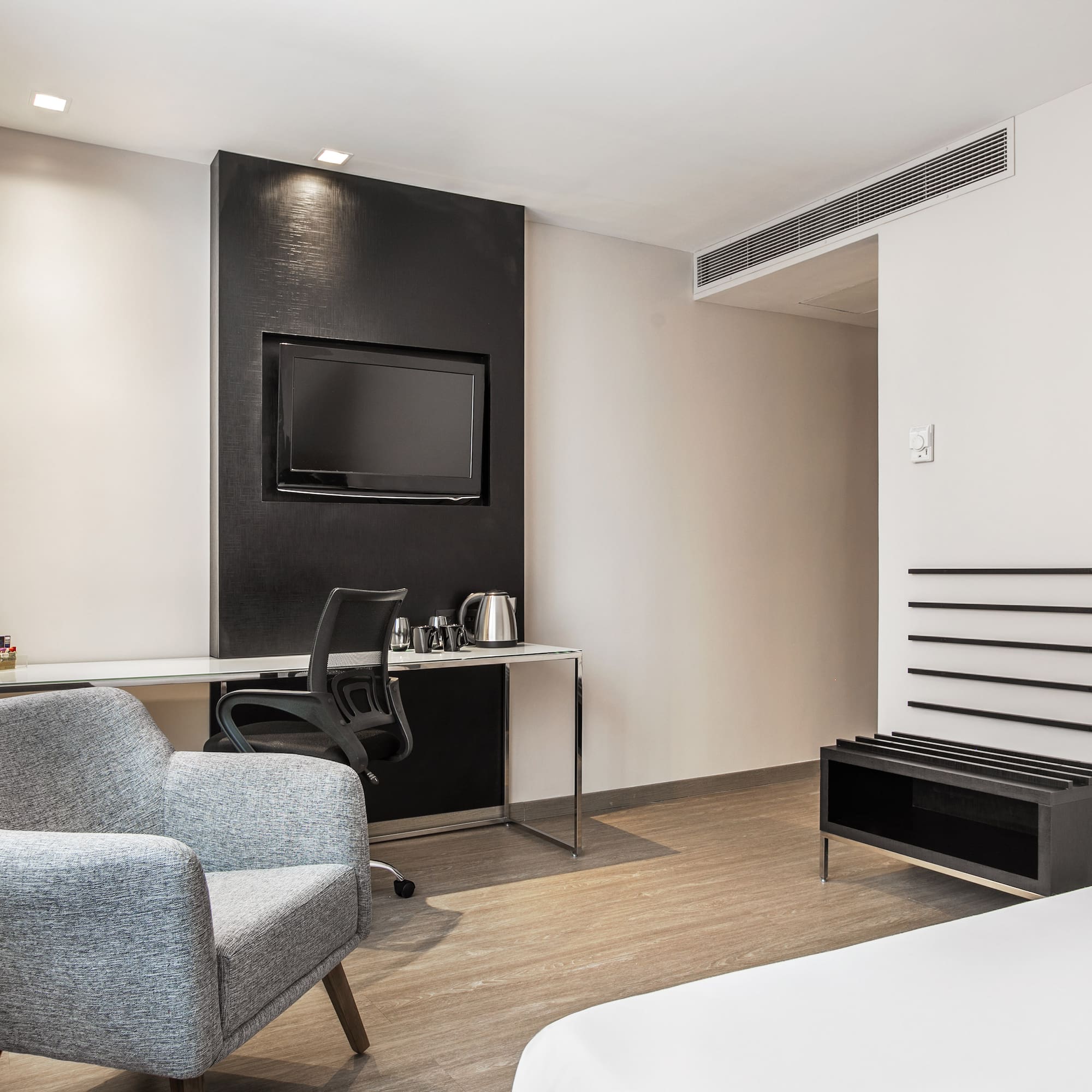 a room with a bed and a chair