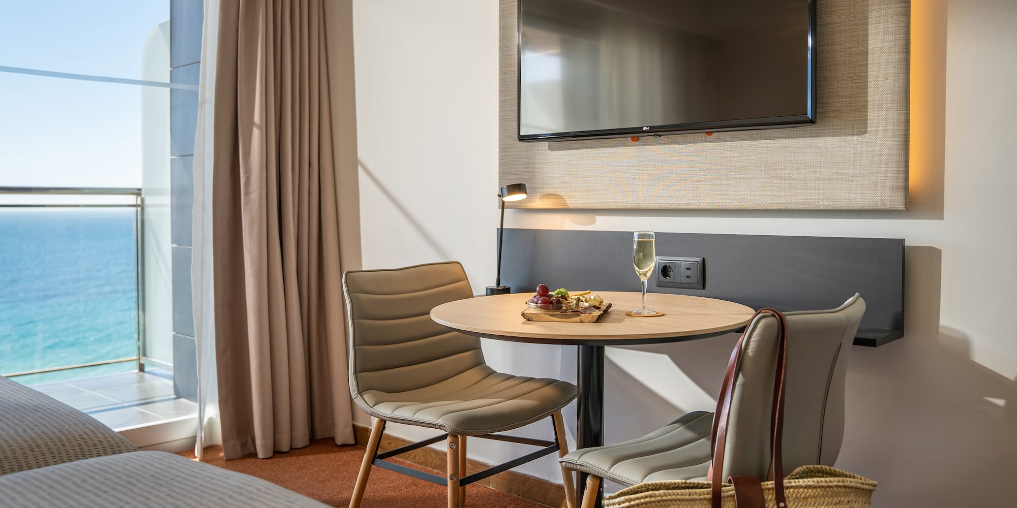 a room with a table and chairs and a television