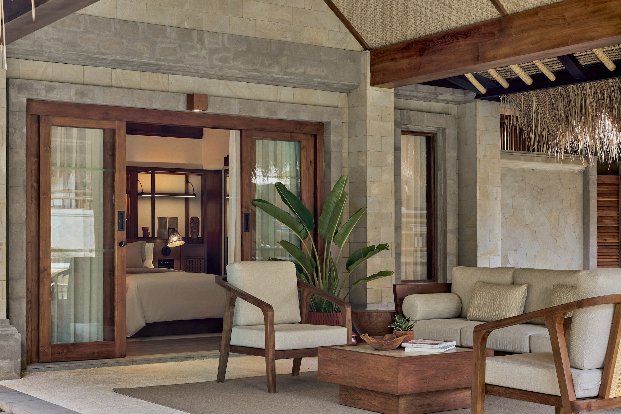 a patio area with chairs and a table