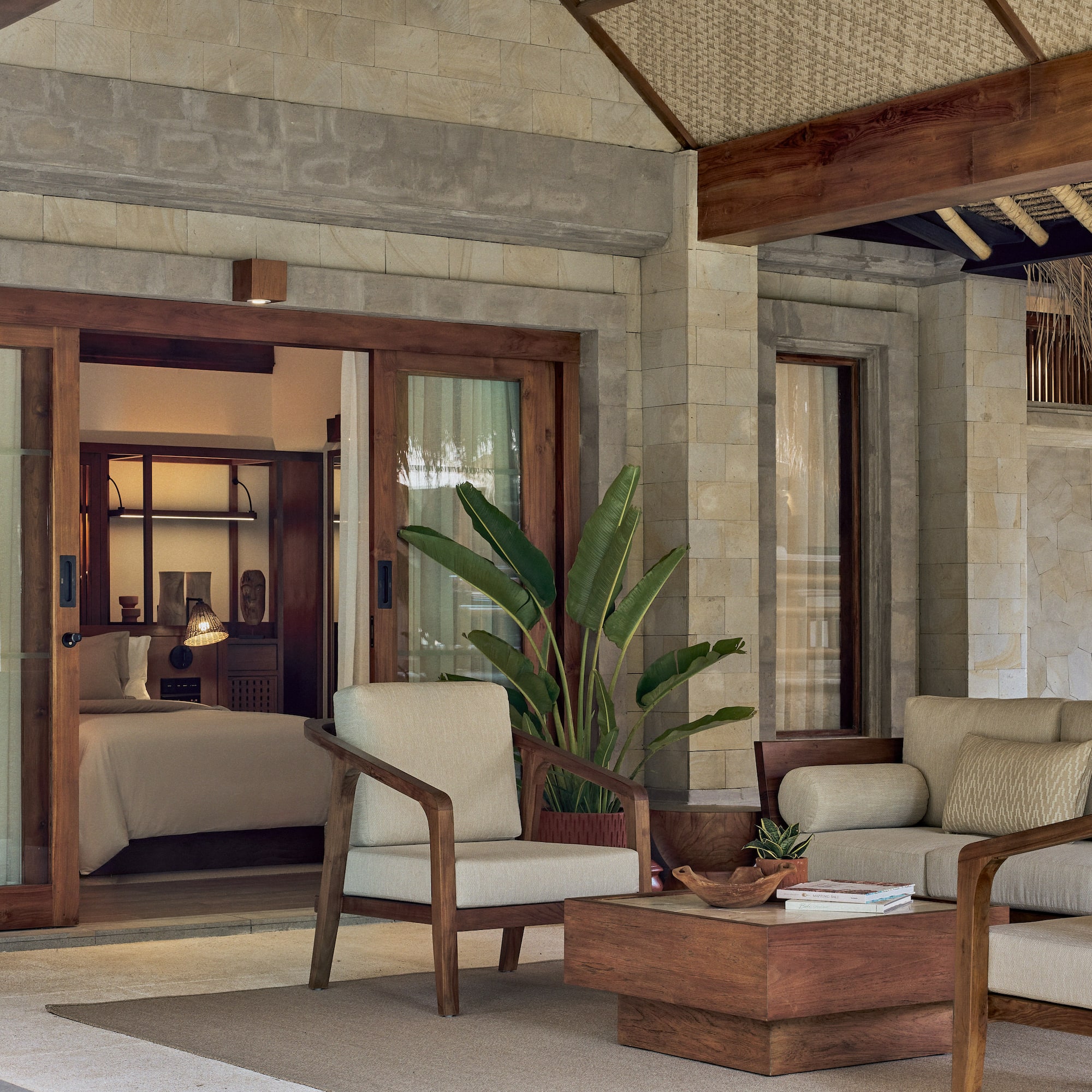 a patio area with chairs and a table