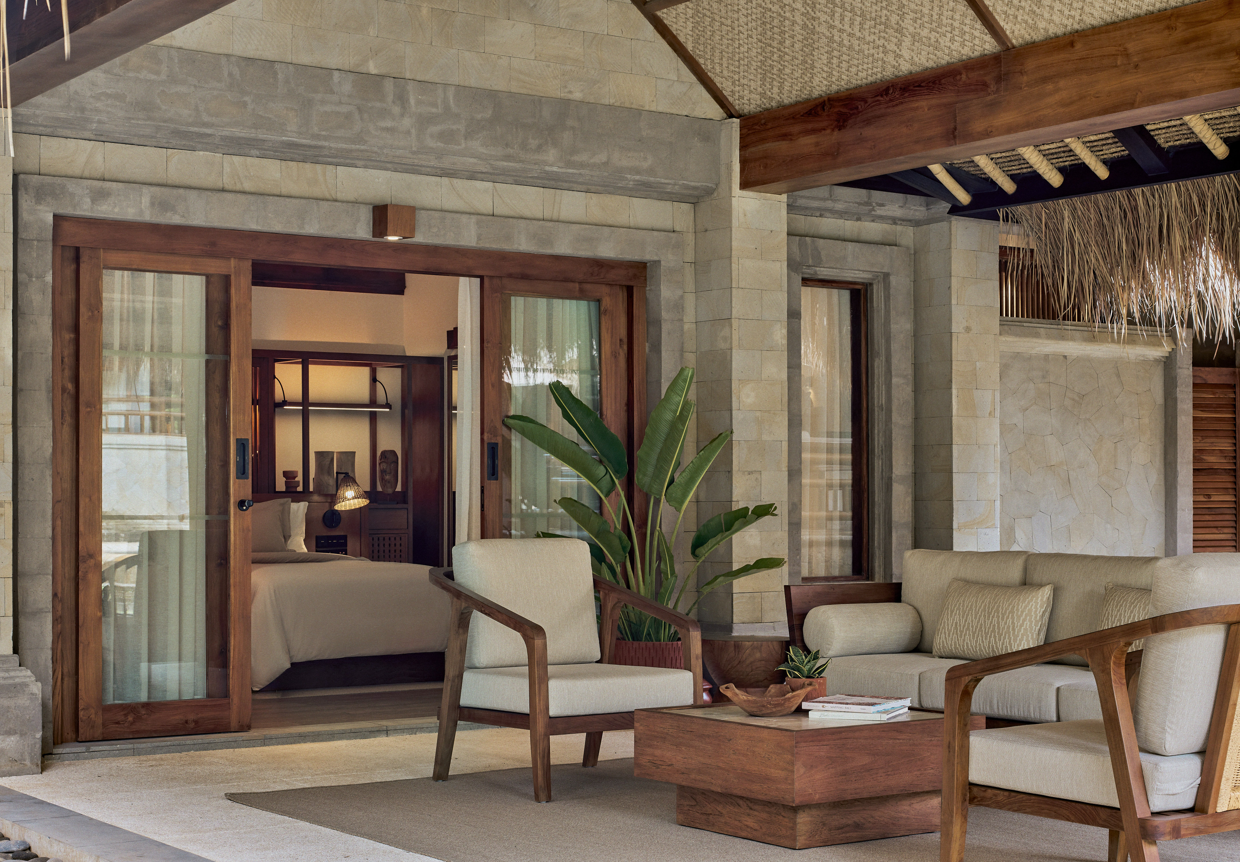 a patio area with chairs and a table