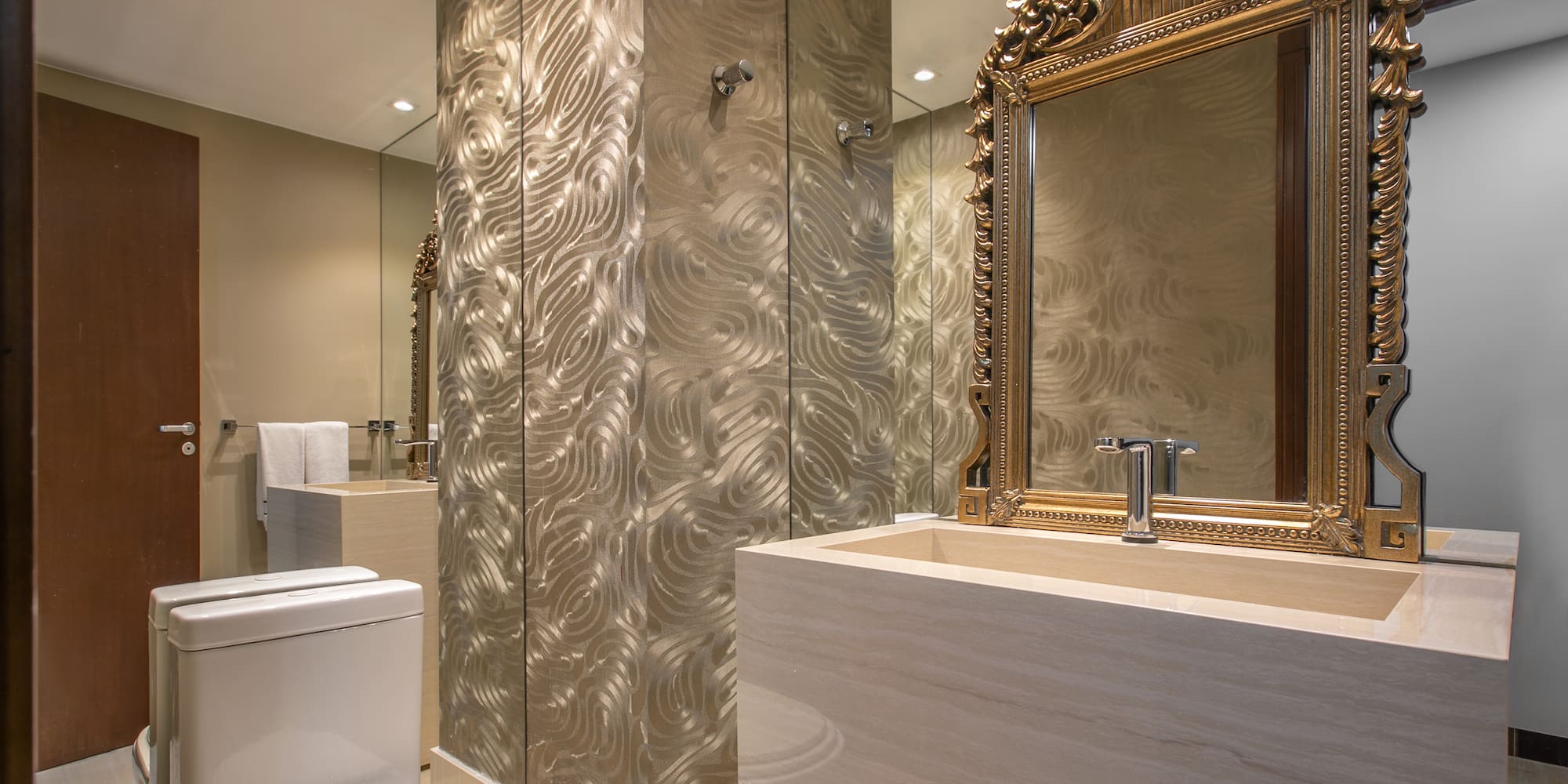 a bathroom with a mirror and a sink