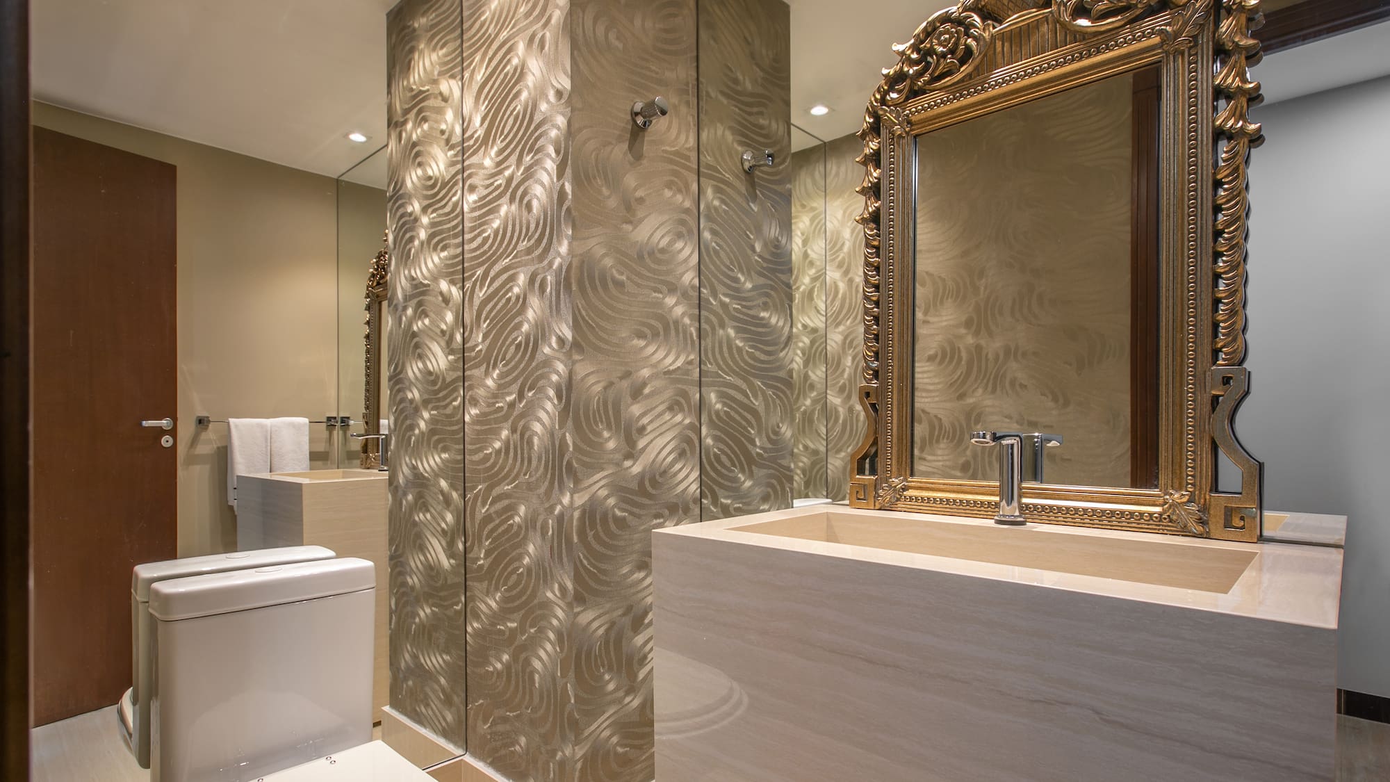 a bathroom with a mirror and a sink