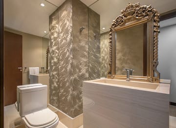 a bathroom with a mirror and a sink