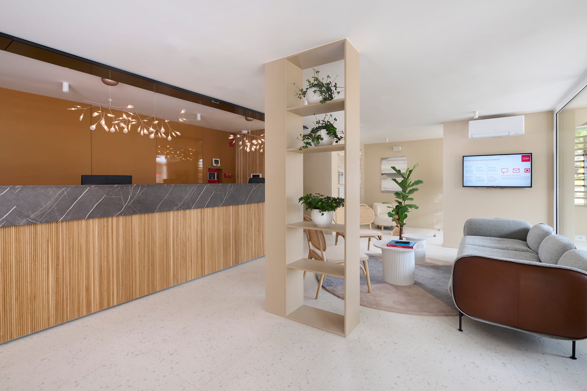 a room with a reception desk and a couch
