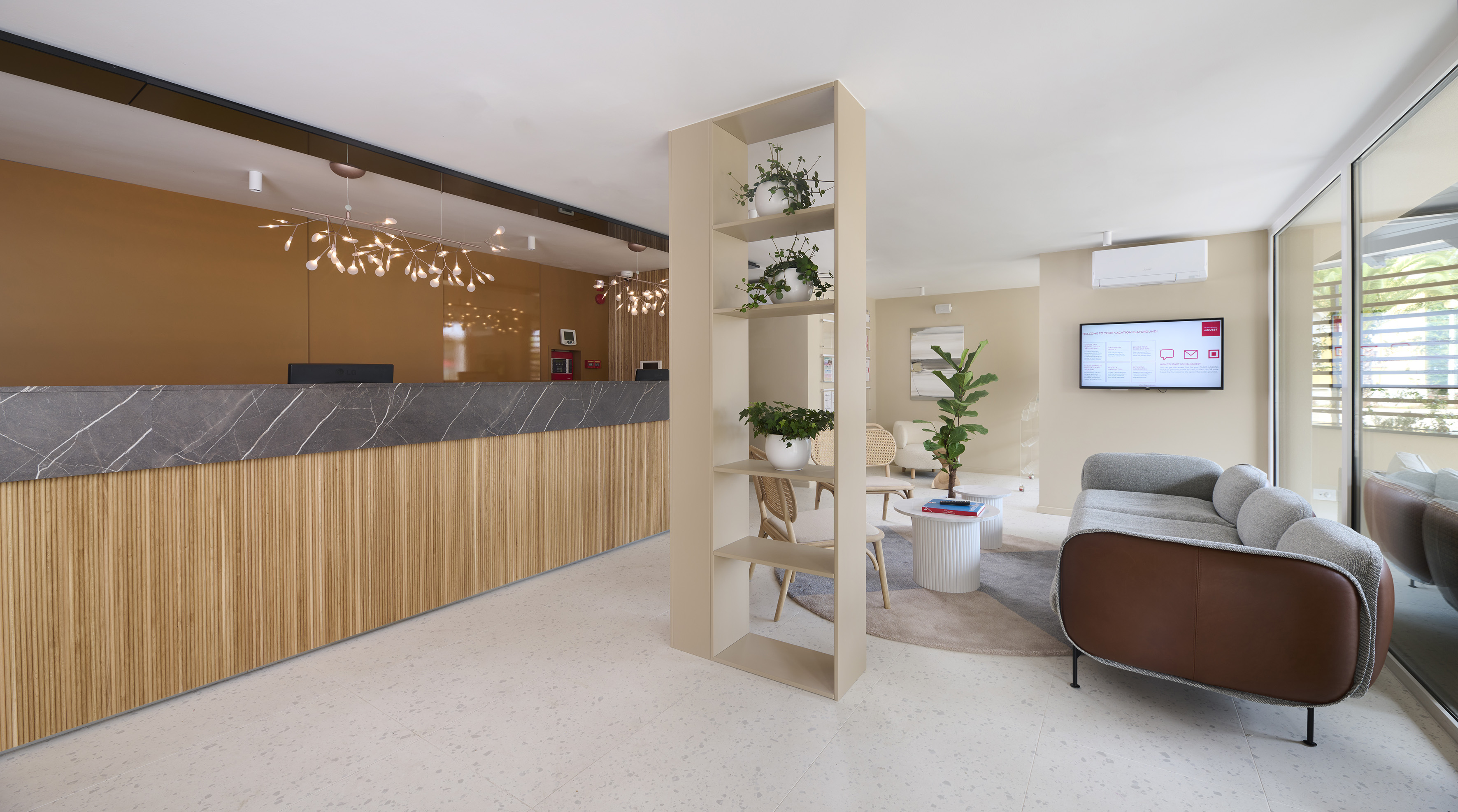 a room with a reception desk and a couch